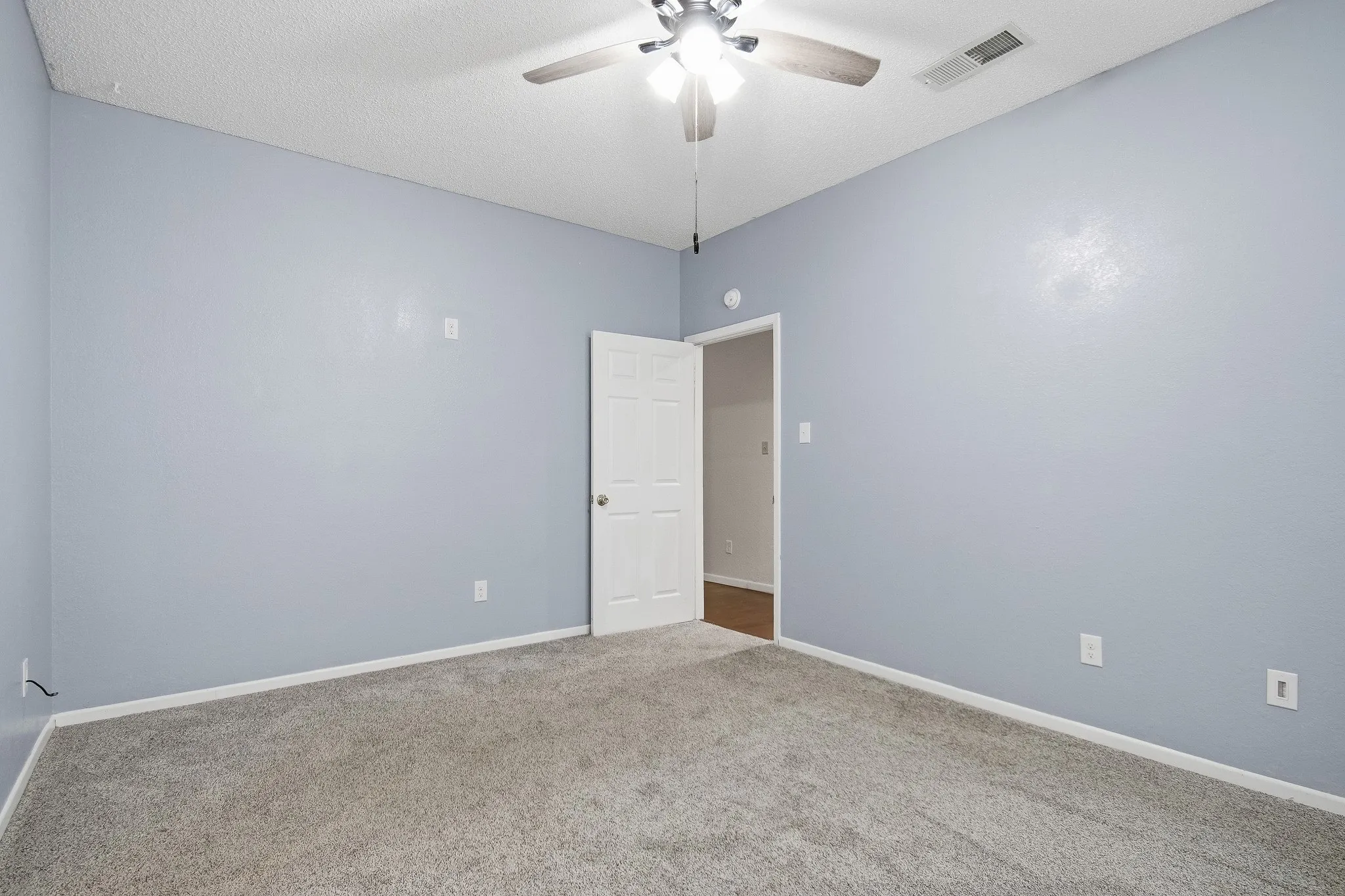 Neutral-toned carpeting throughout