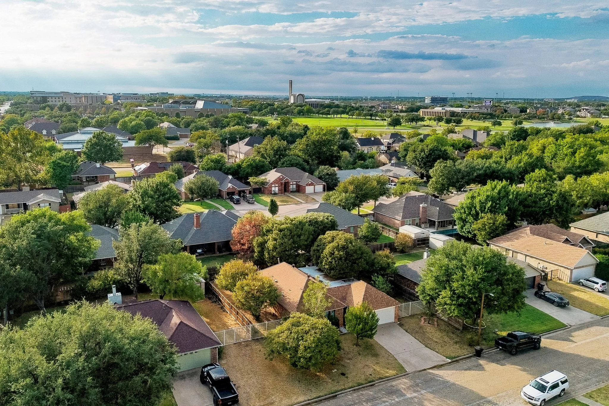 Residential neighborhood featuring mature trees and a variety of architectural styles