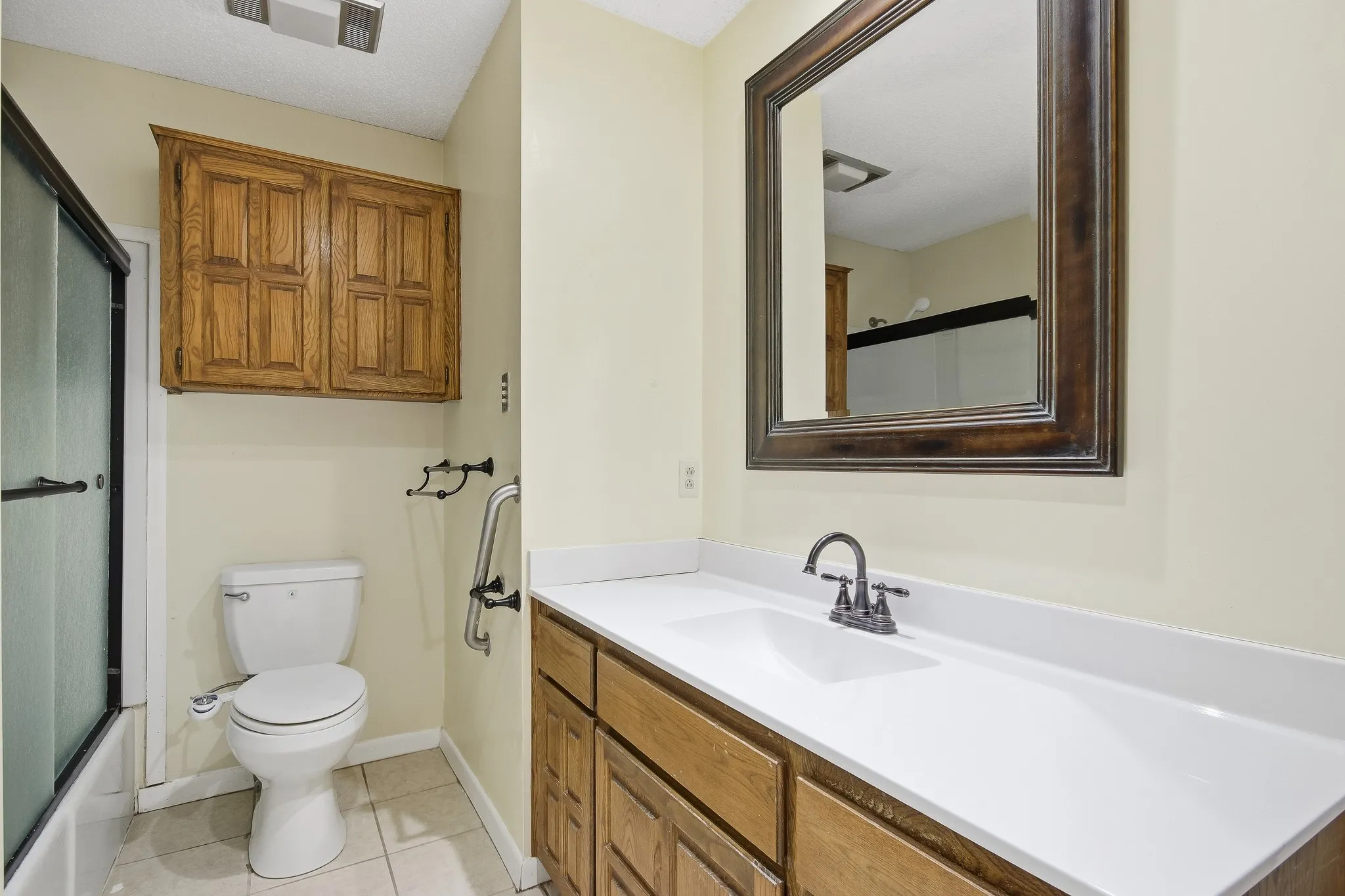 White vanity countertop with integrated sink and dark-toned faucet
