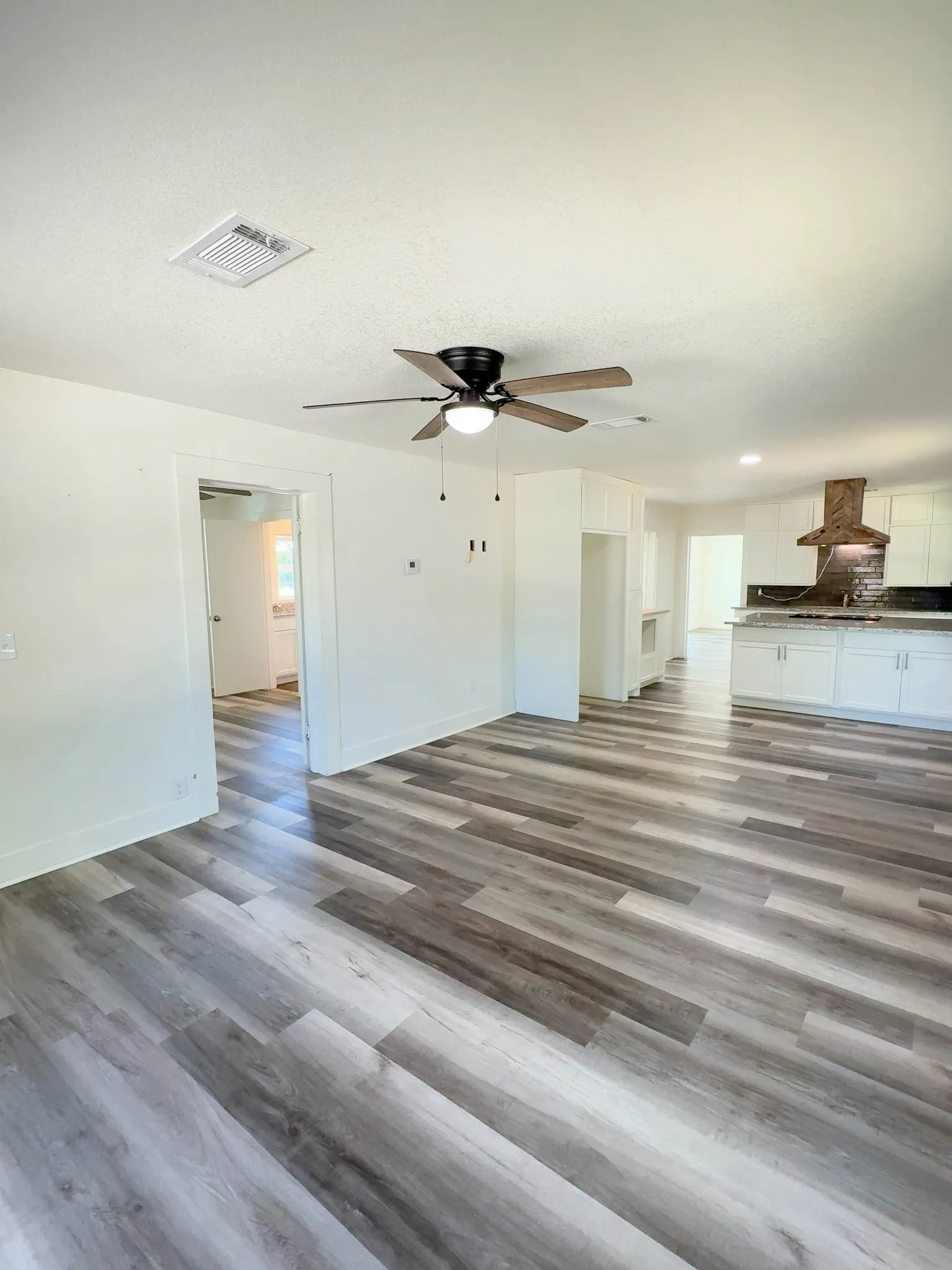 Open concept living, dining, and kitchen area