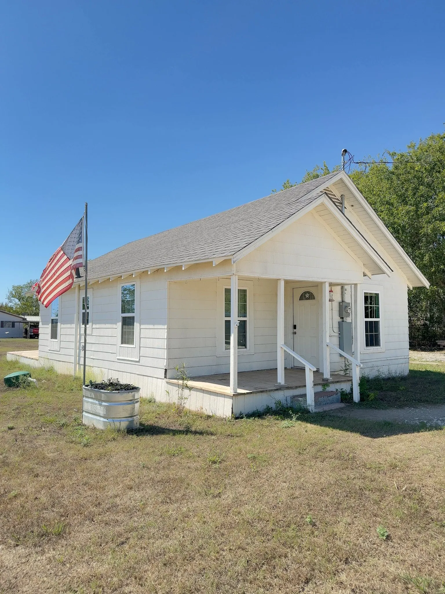 Front porch and exterior of a country home in Oglesby, Texas