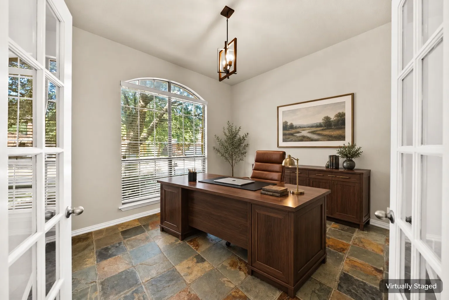 French doors with glass panels, arched window with blinds, multi-toned slate tile flooring, and a central ceiling light fixture