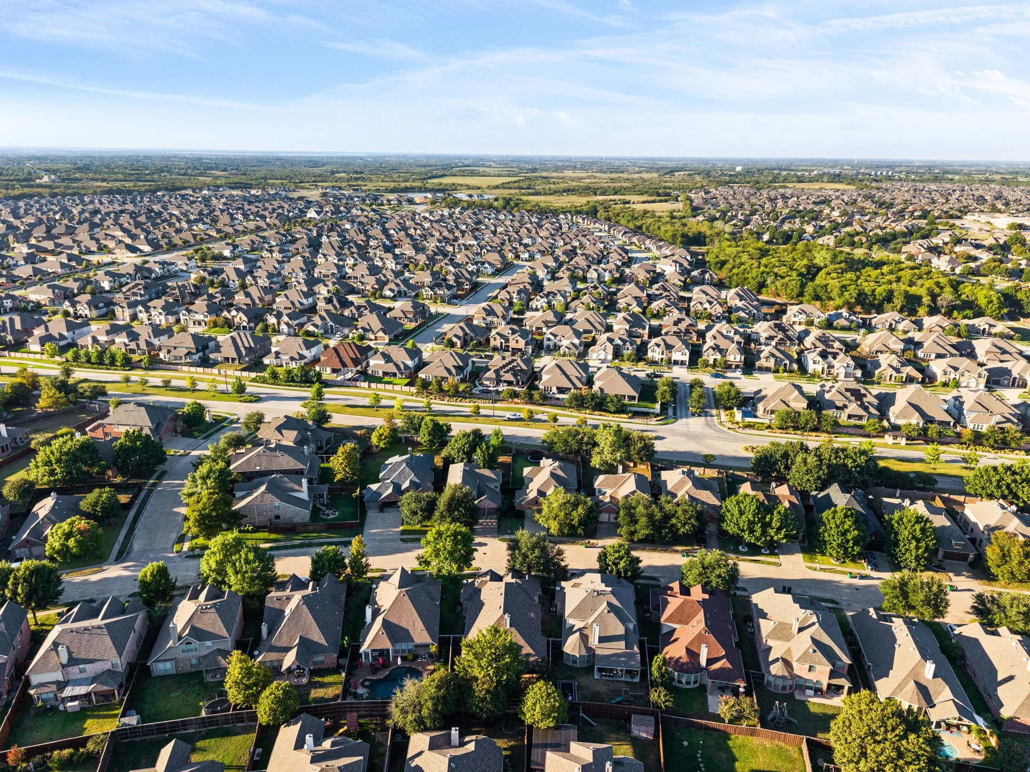 Expansive residential community featuring tree-lined streets, established landscaping, and consistent architectural design throughout the neighborhood