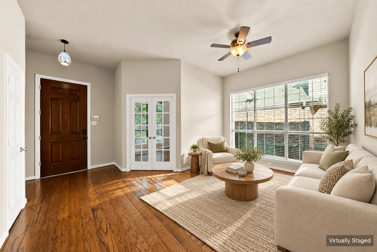Wood-finish flooring, white French doors, expansive window with blinds, ceiling fan, and recessed lighting