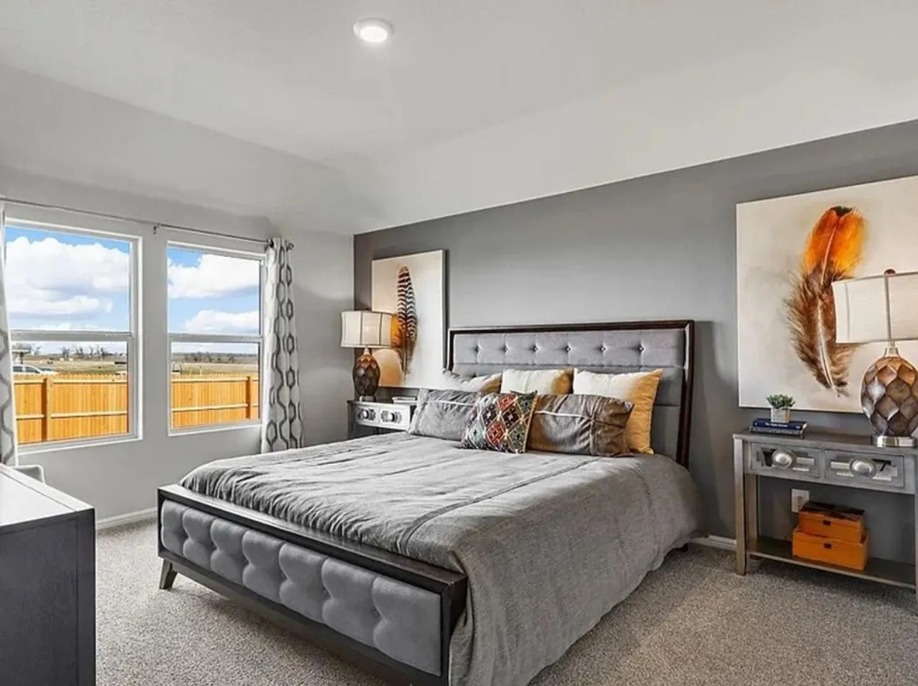 Staged Carpeted bedroom featuring baseboards.  Room is vacant and wall is not currently painted an accent color.