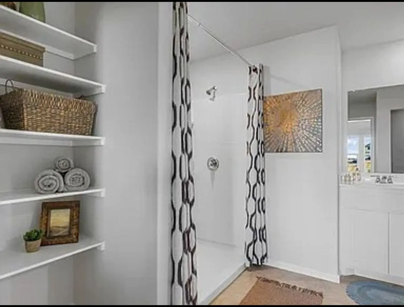 Full bath with a stall shower and vanity