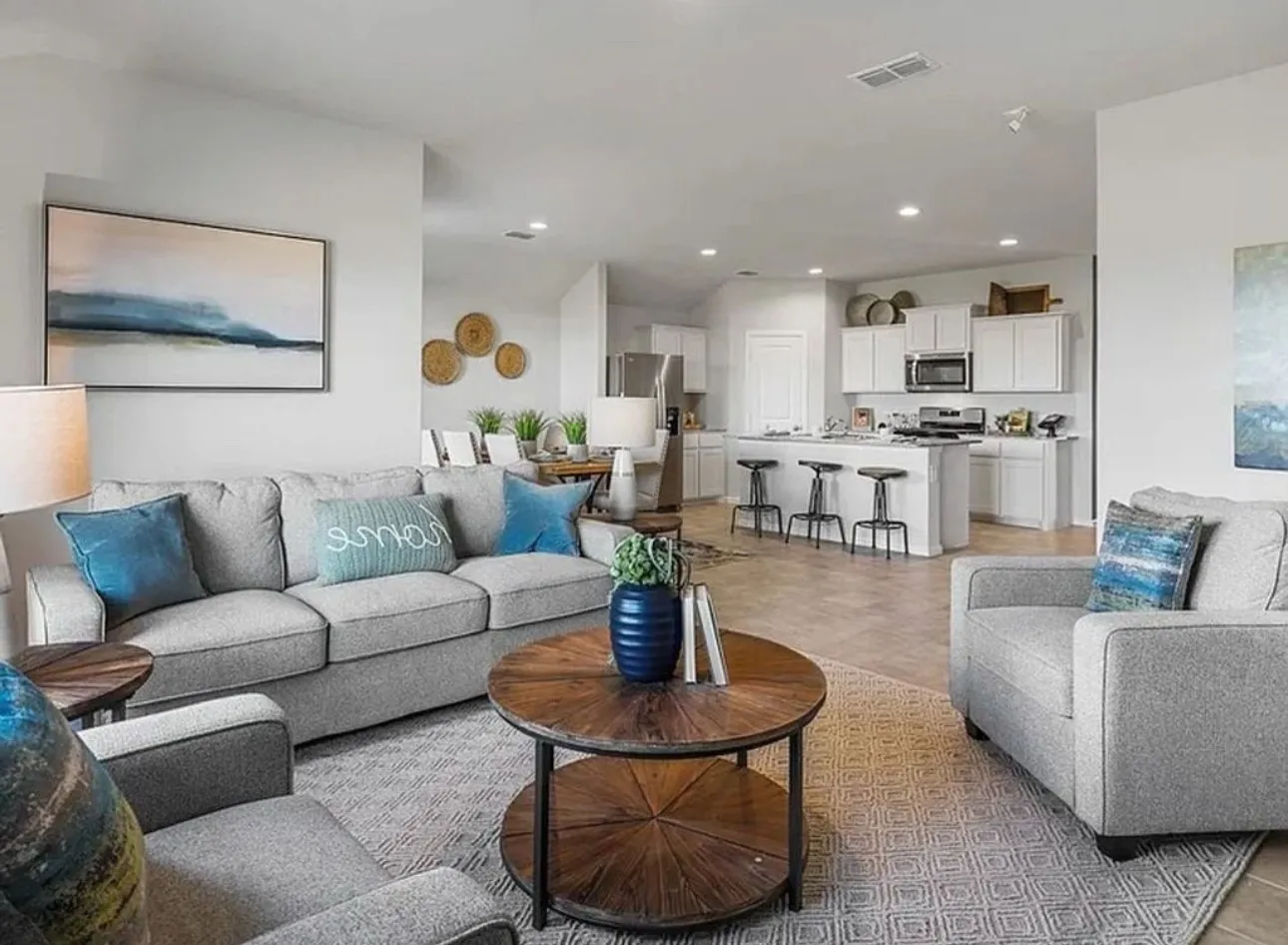 Staged Living room featuring recessed lighting.  Home is currently vacant.