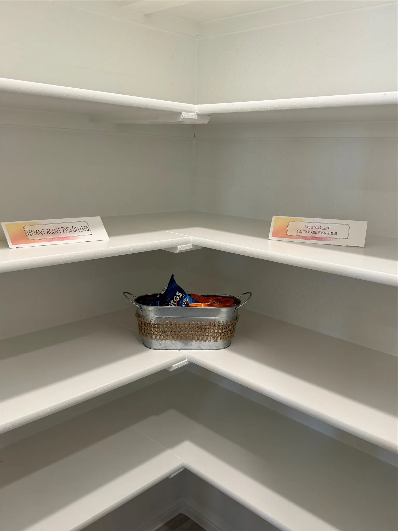 View of large pantry with motion sensor lighting.