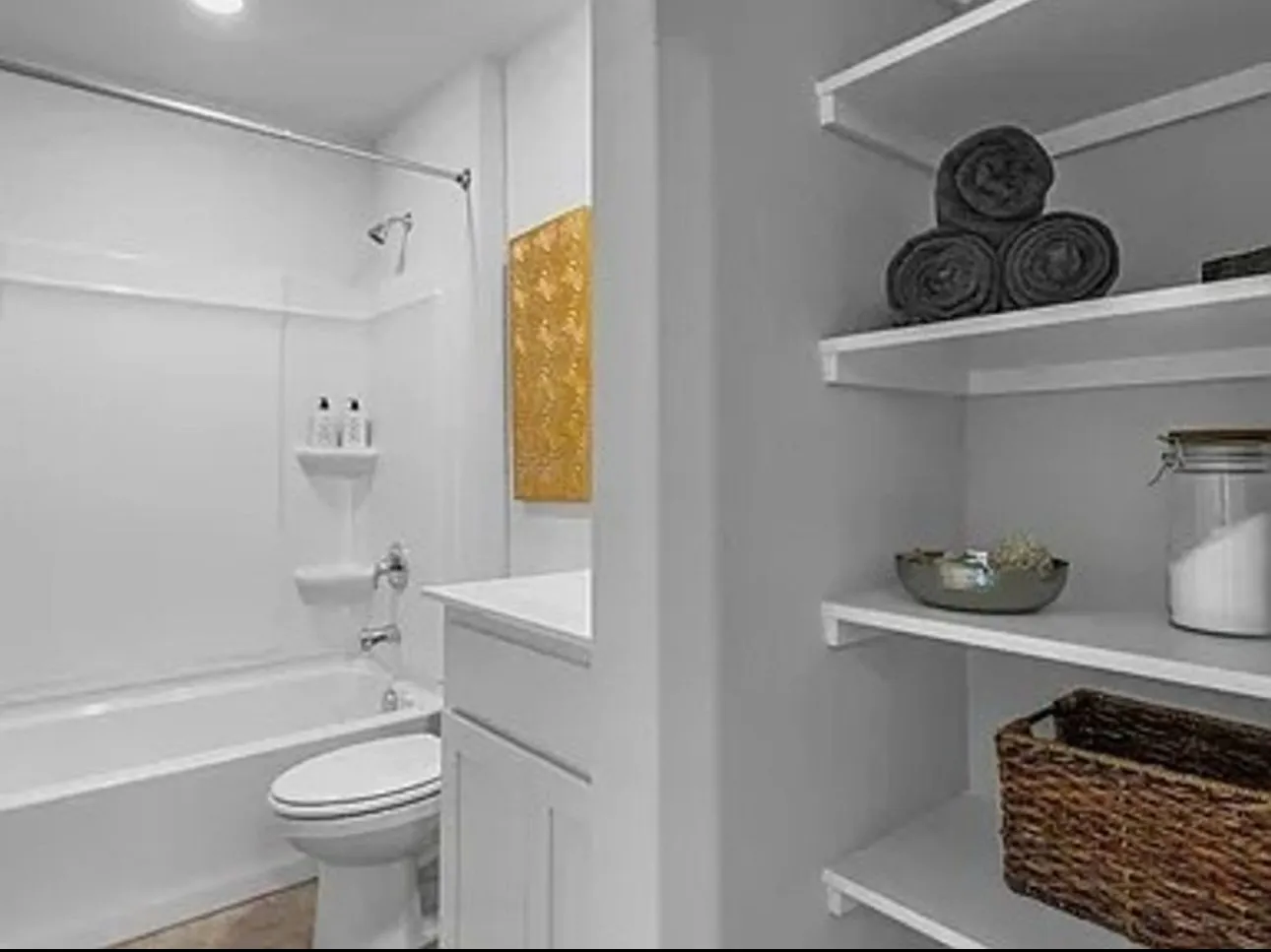 Bathroom with shower / tub combination, vanity, and dark tile patterned floors