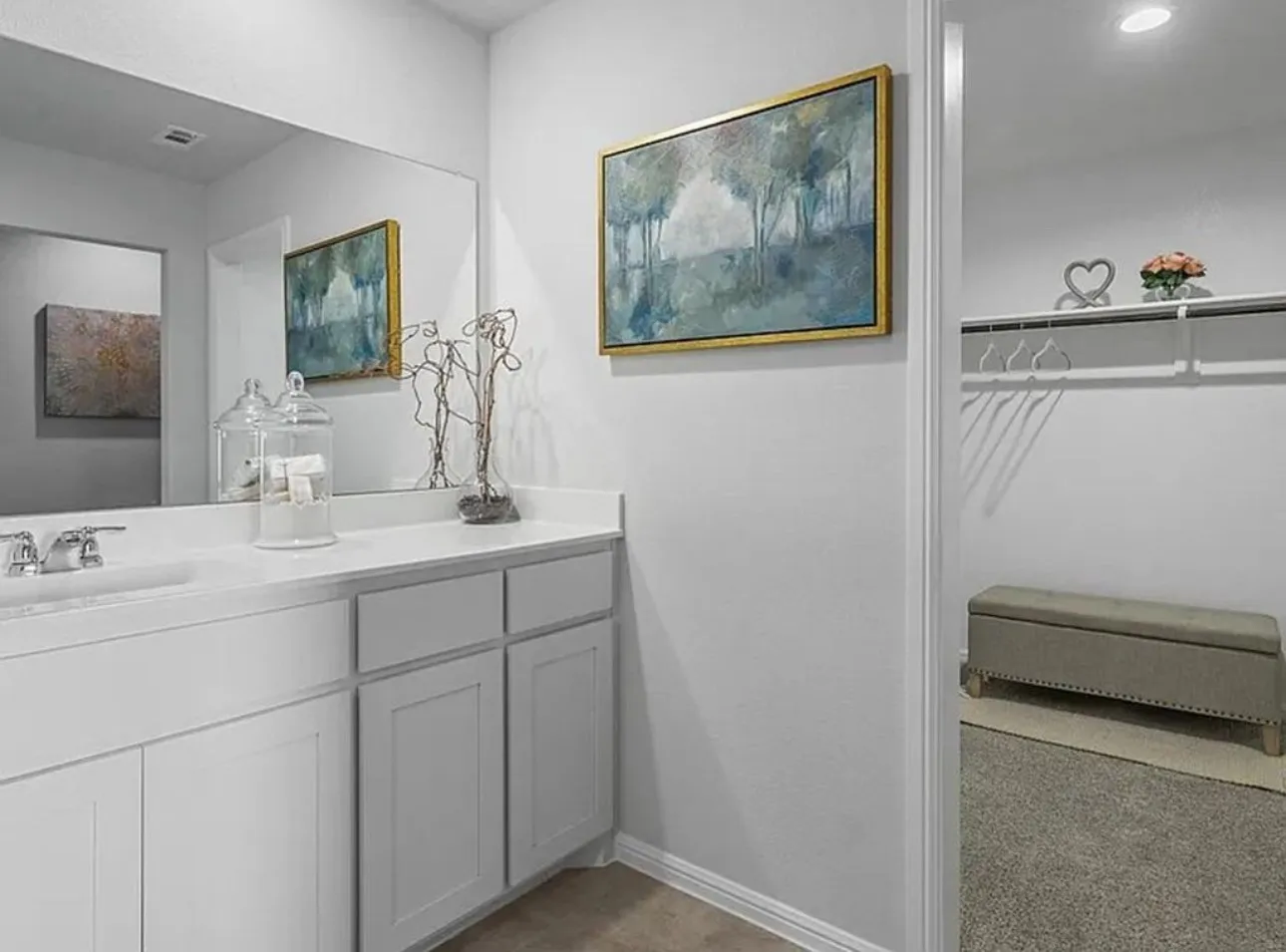 Full bath featuring vanity and baseboards