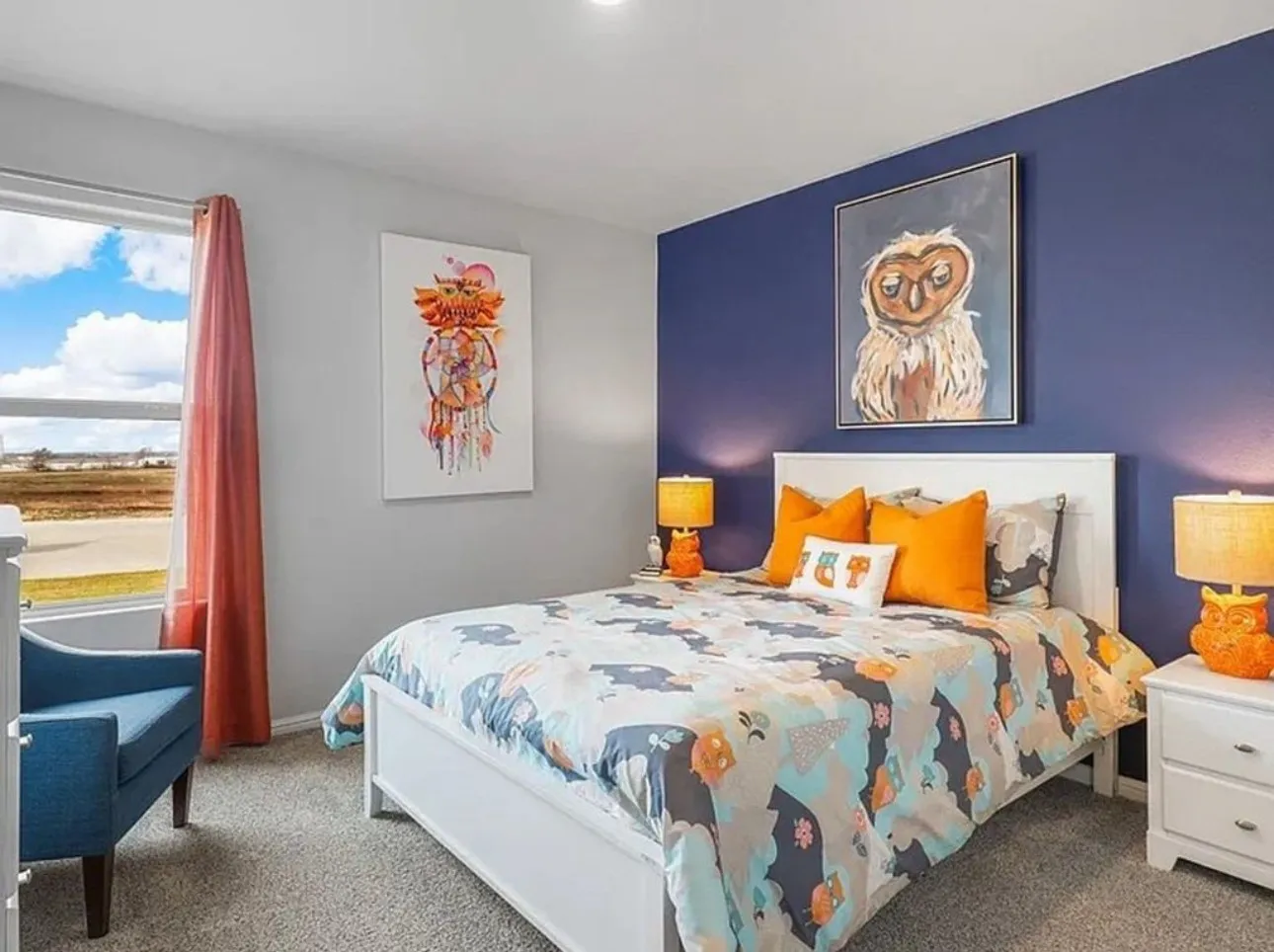 Staged Carpeted bedroom featuring baseboards. Home is vacant and this room no longer has the accent wall color.