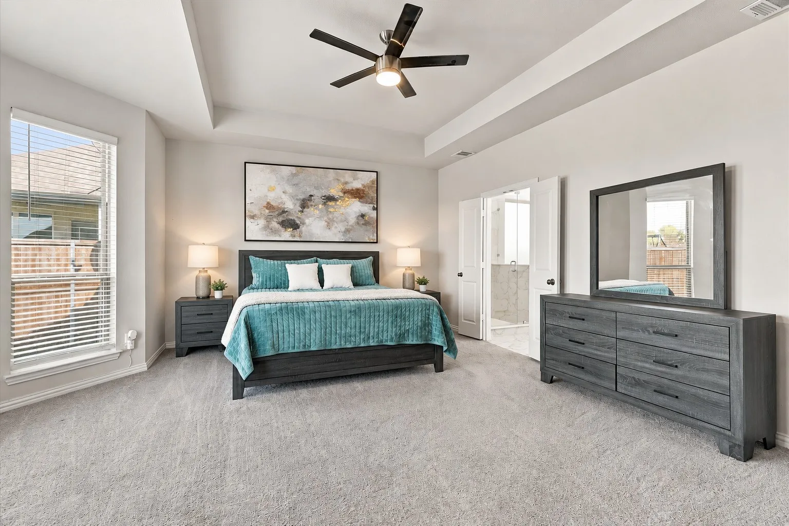 Tray ceiling with recessed lighting and a ceiling fan