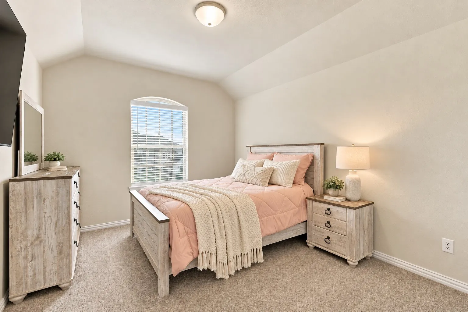 Arched window with blinds, vaulted ceiling, recessed lighting, and neutral carpeting