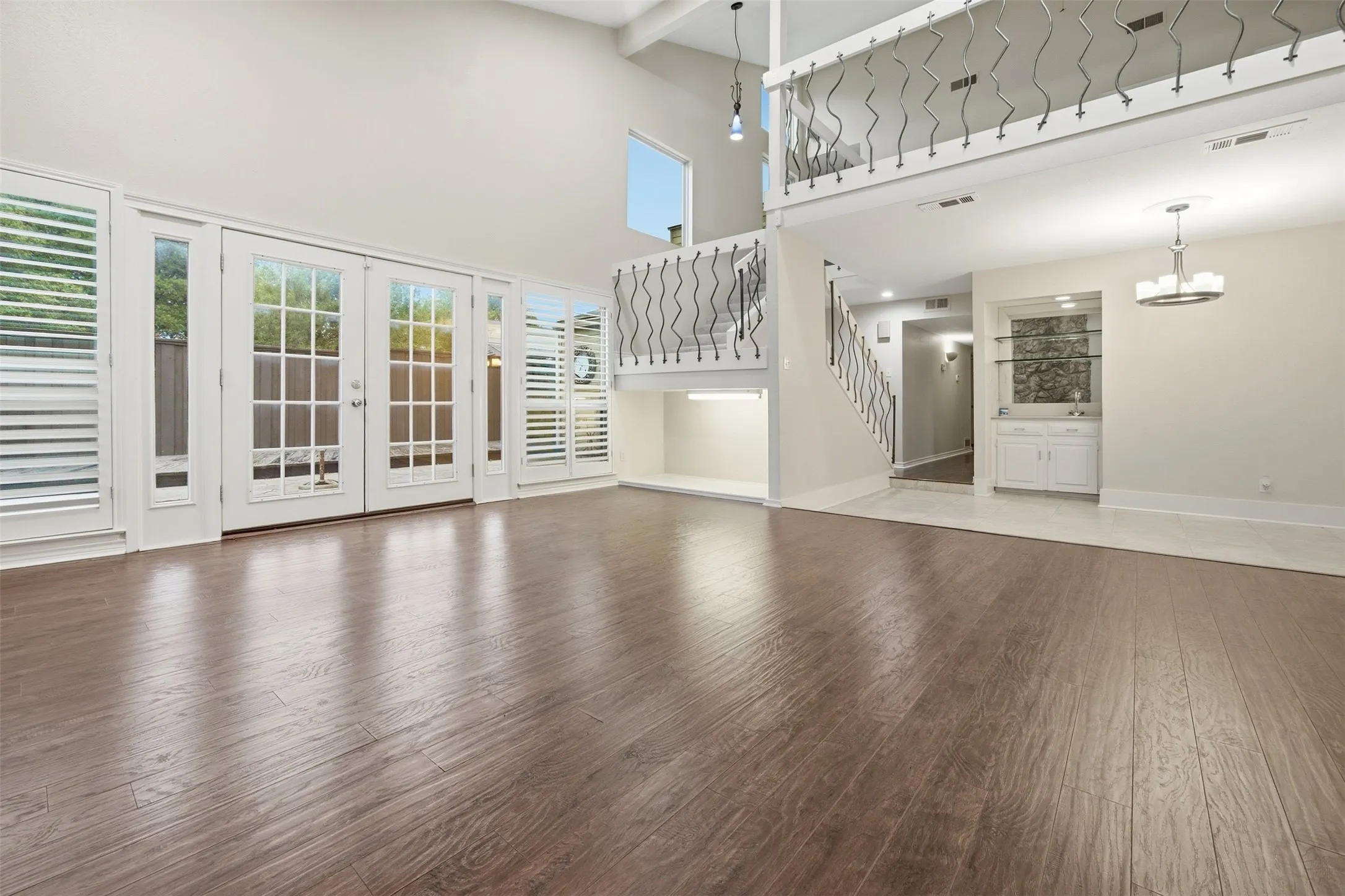 High ceilings and wood-finish flooring