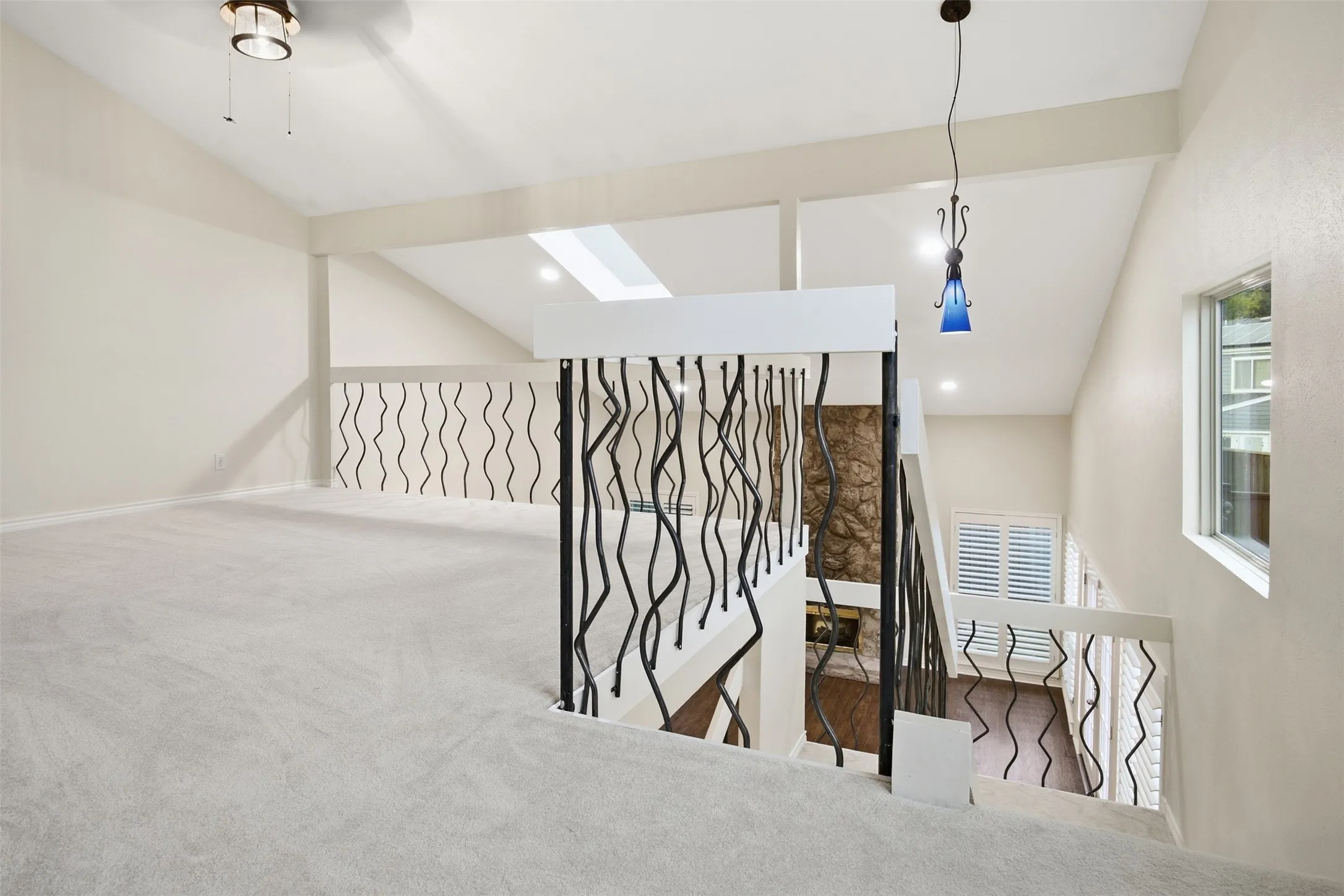 Vaulted ceilings, skylight, and decorative wrought iron railings