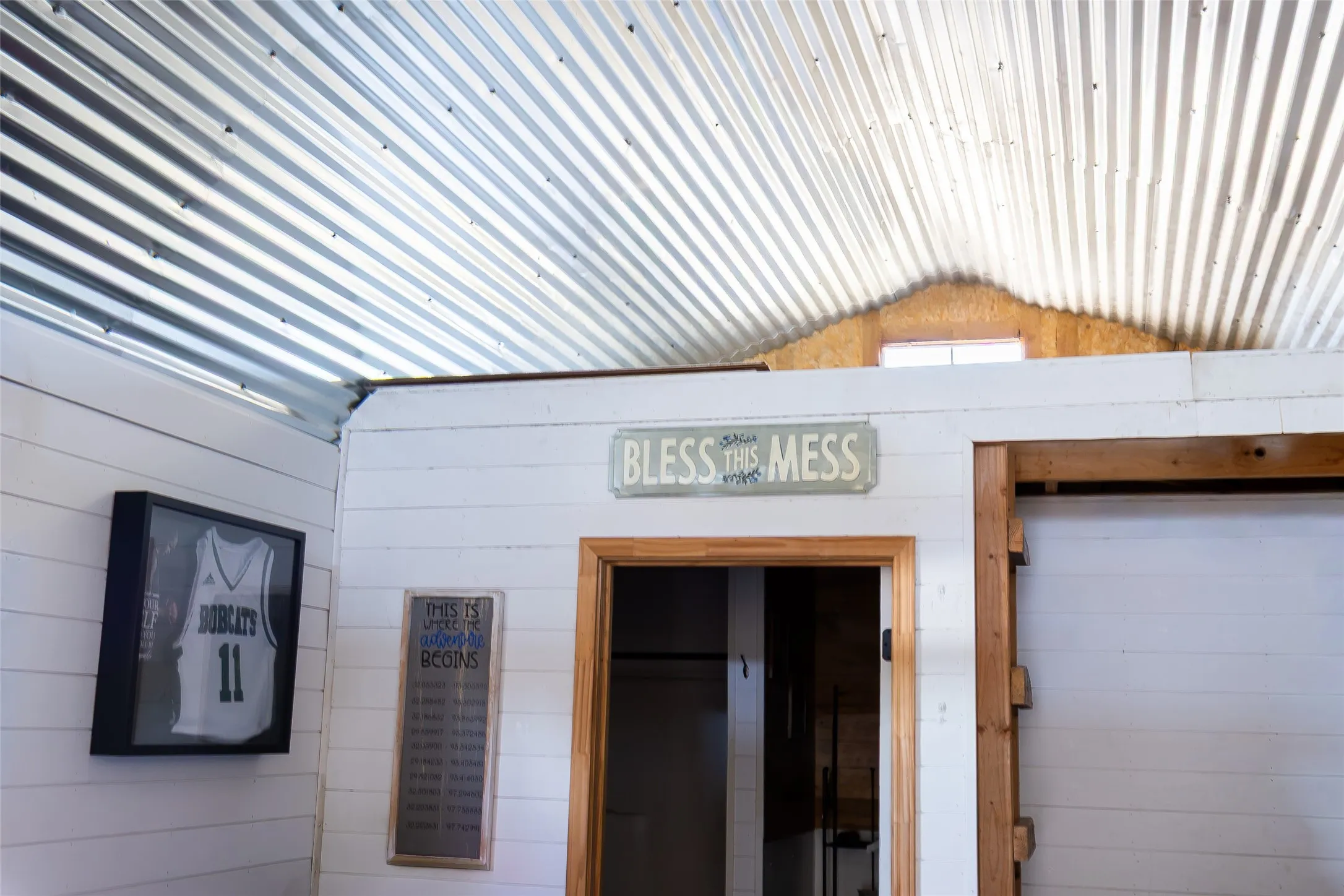 Tiny House has a loft, large bedroom, kitchen, living areas.