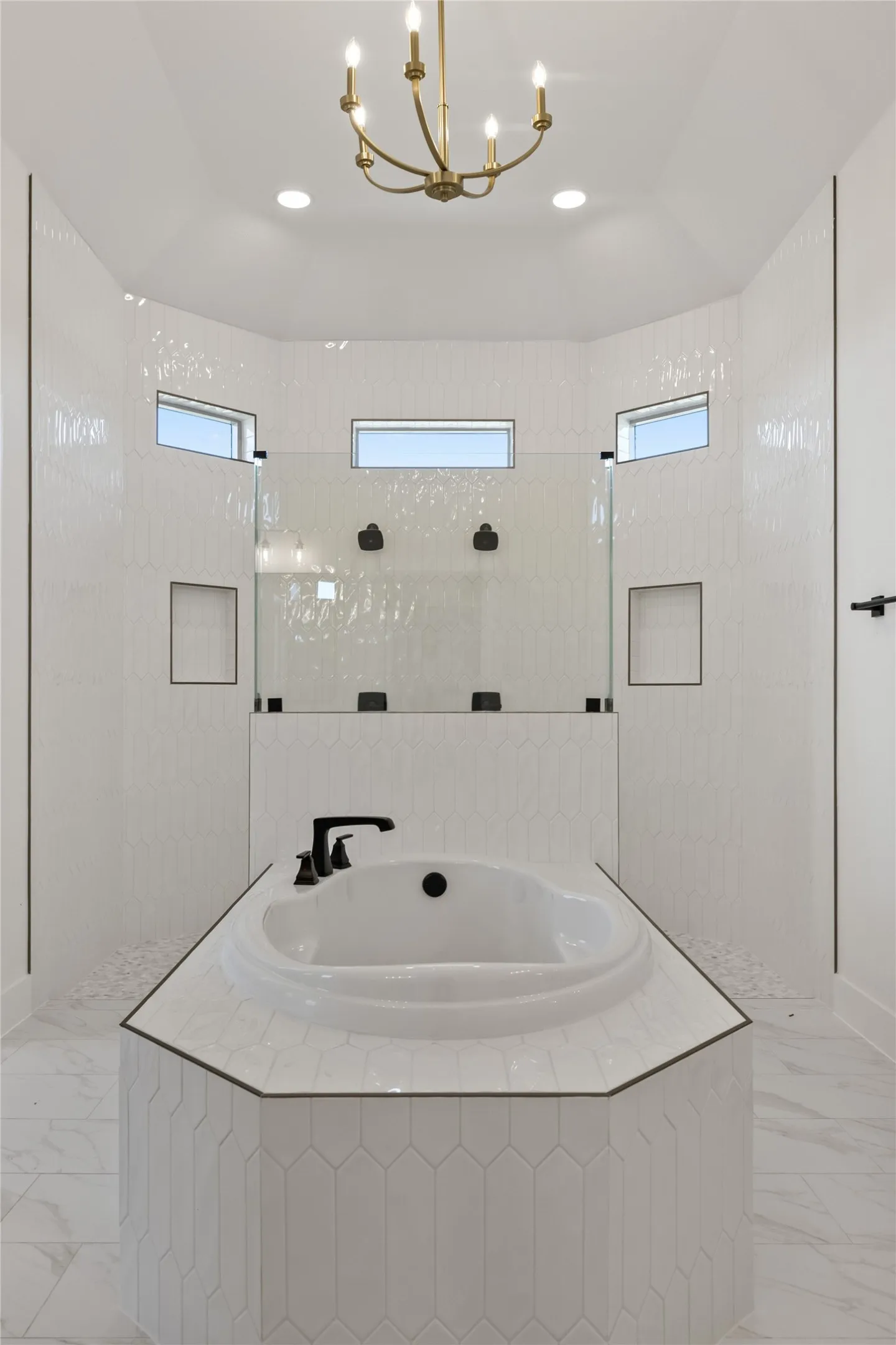 Built-in soaking tub with matte black fixtures