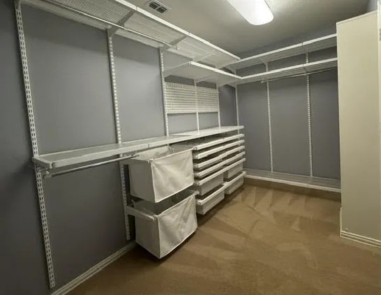 Enter this spacious closest with amazing storage system