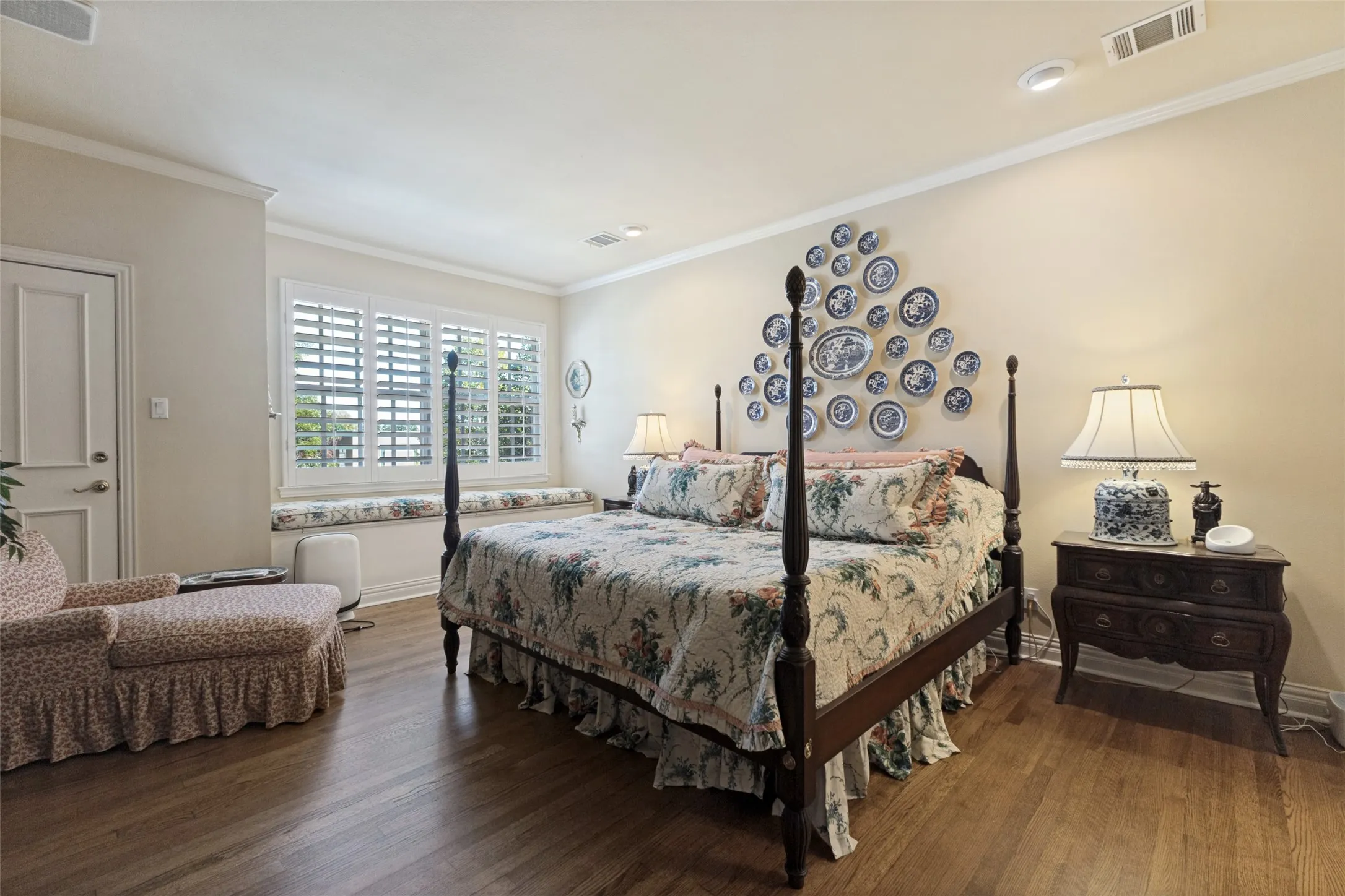 Hardwood flooring, crown molding, recessed lighting, window bench, plantation shutters