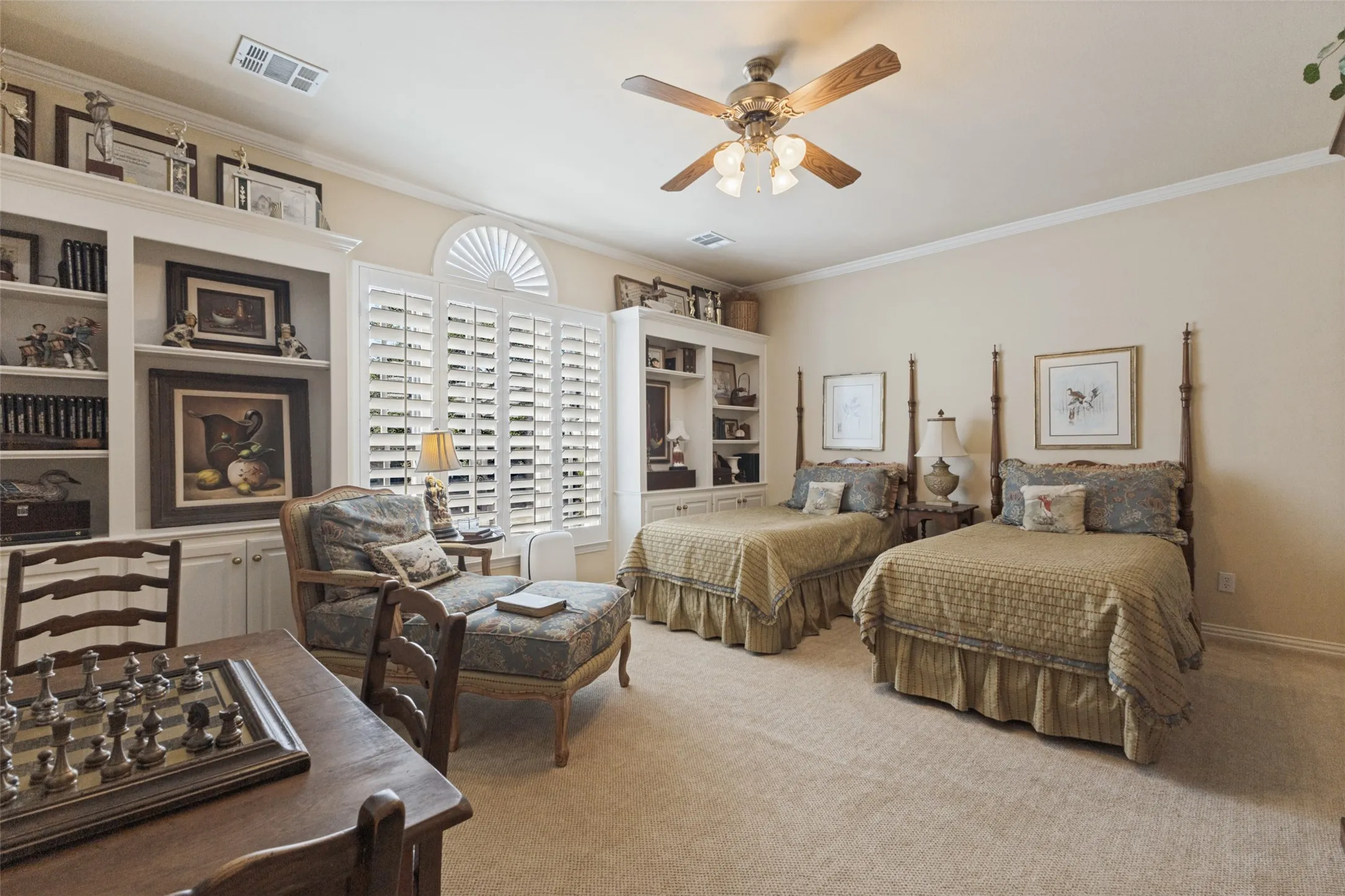 Built-in shelving, plantation shutters, and crown molding