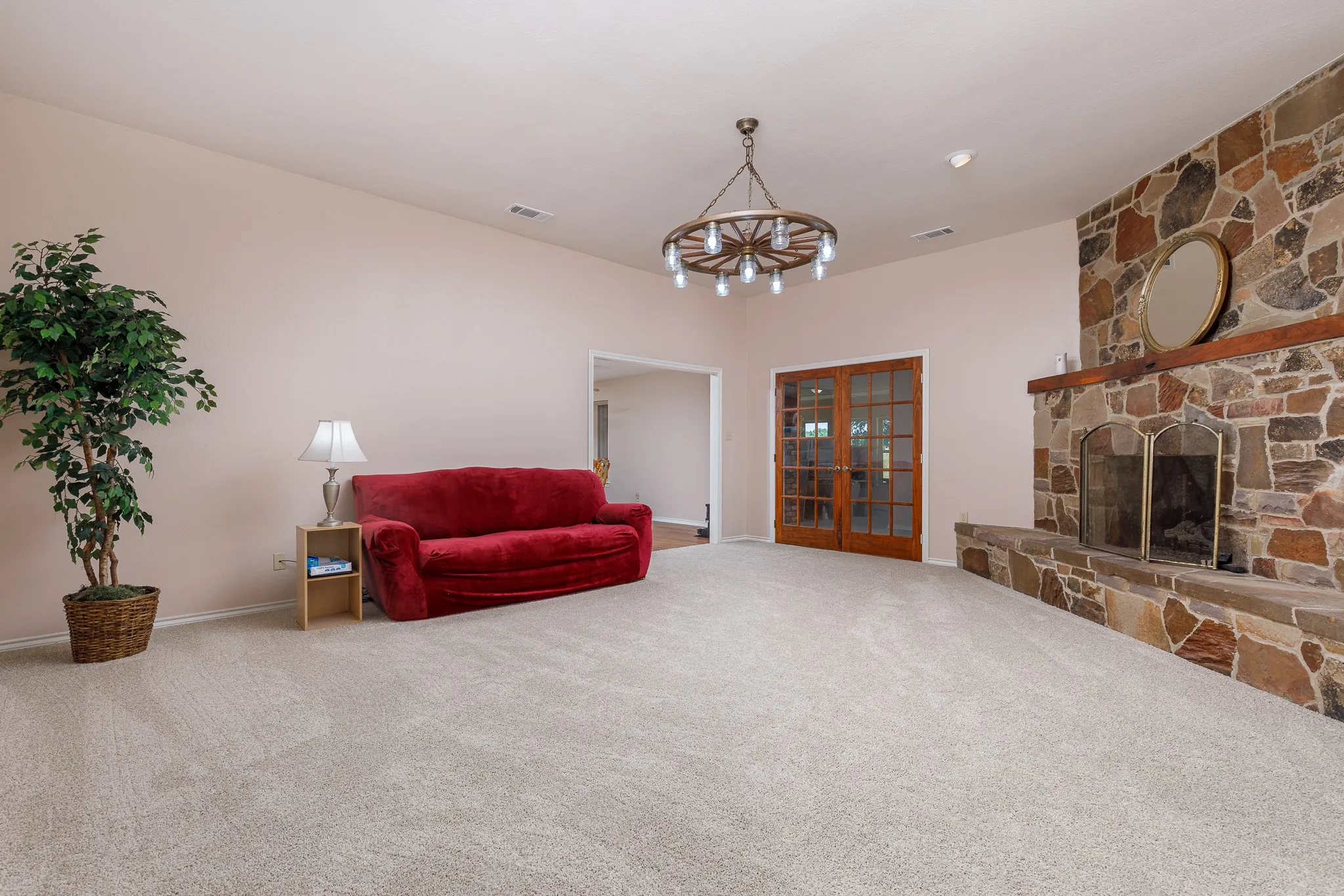 large living with stone fireplace