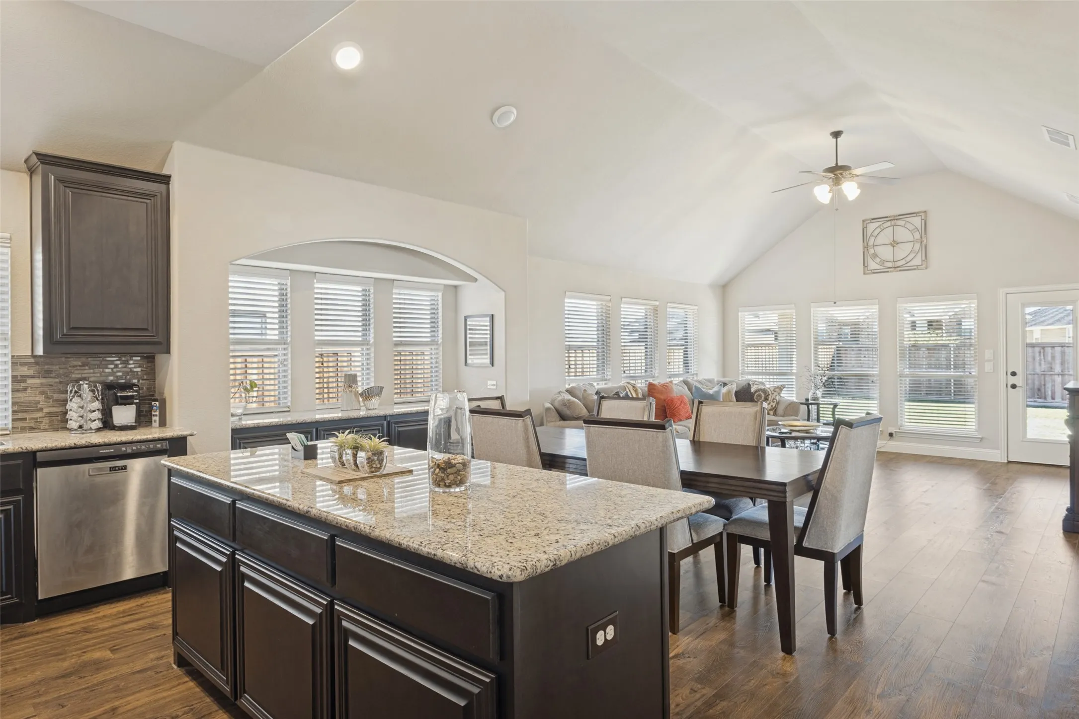 Another view of kitchen over looking dining area and living area.
