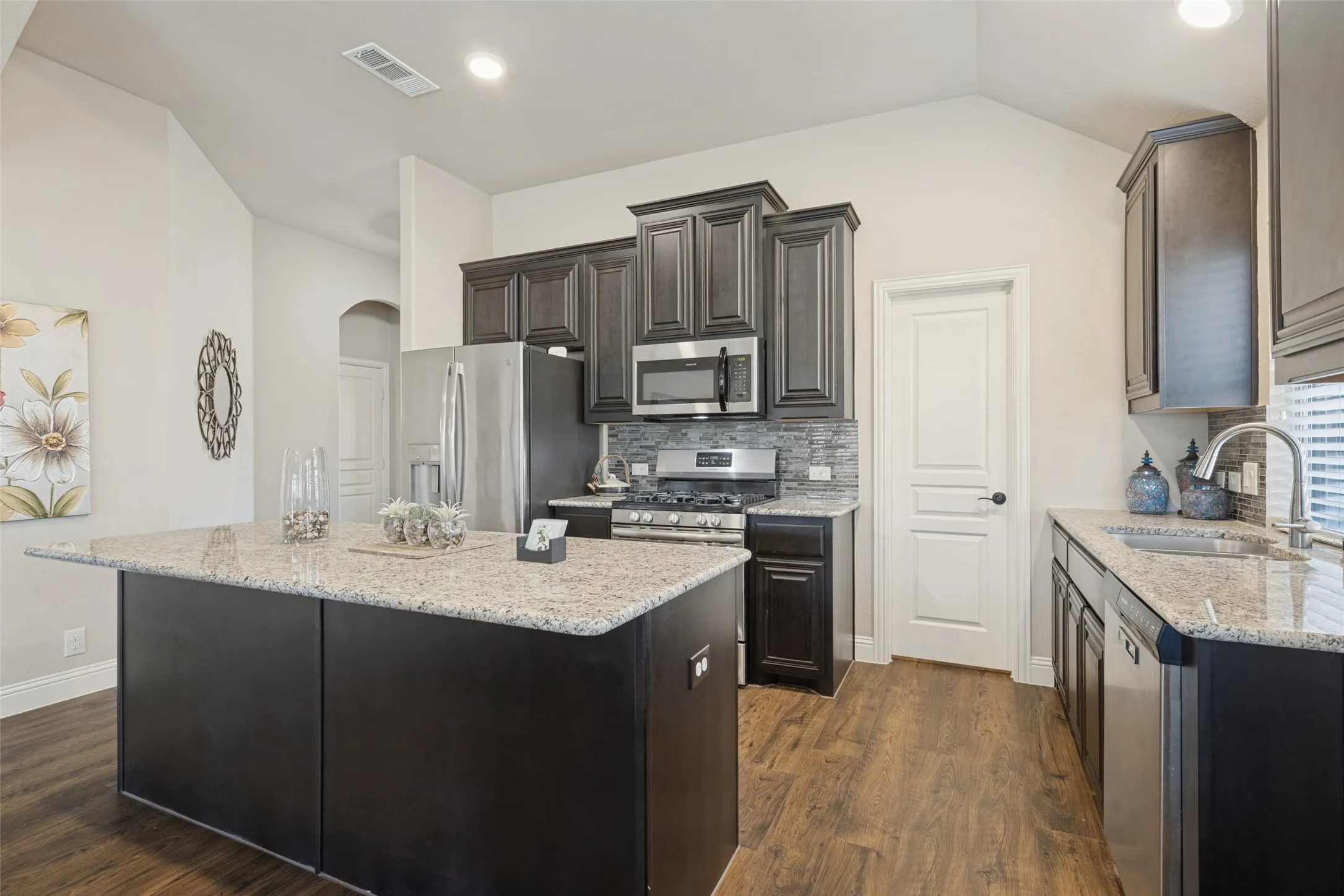 Another view of kitchen with plenty of cabinets, and good counter space.