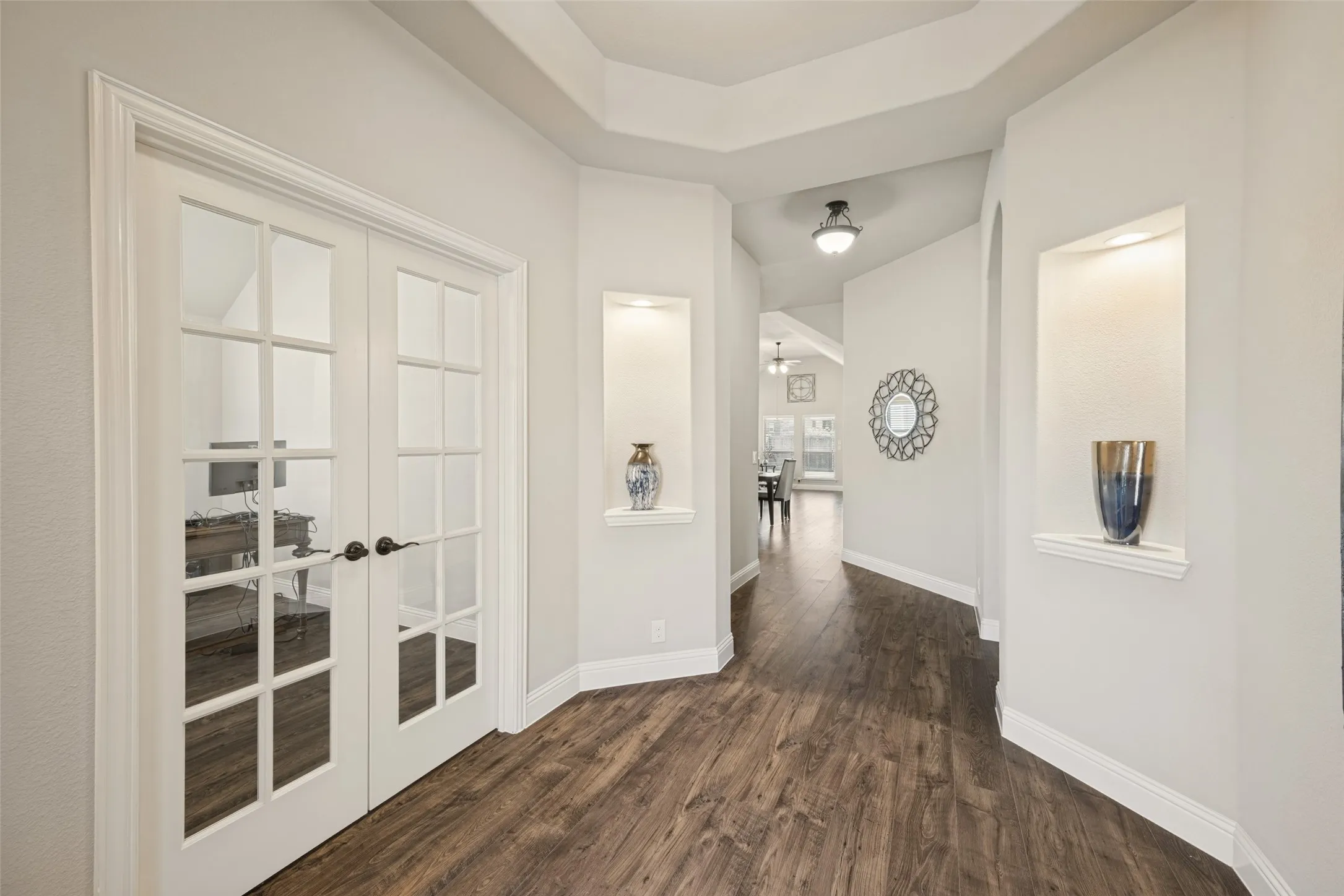 Another view of foyer adjacent to office with French Doors.  Insets are lighted.
