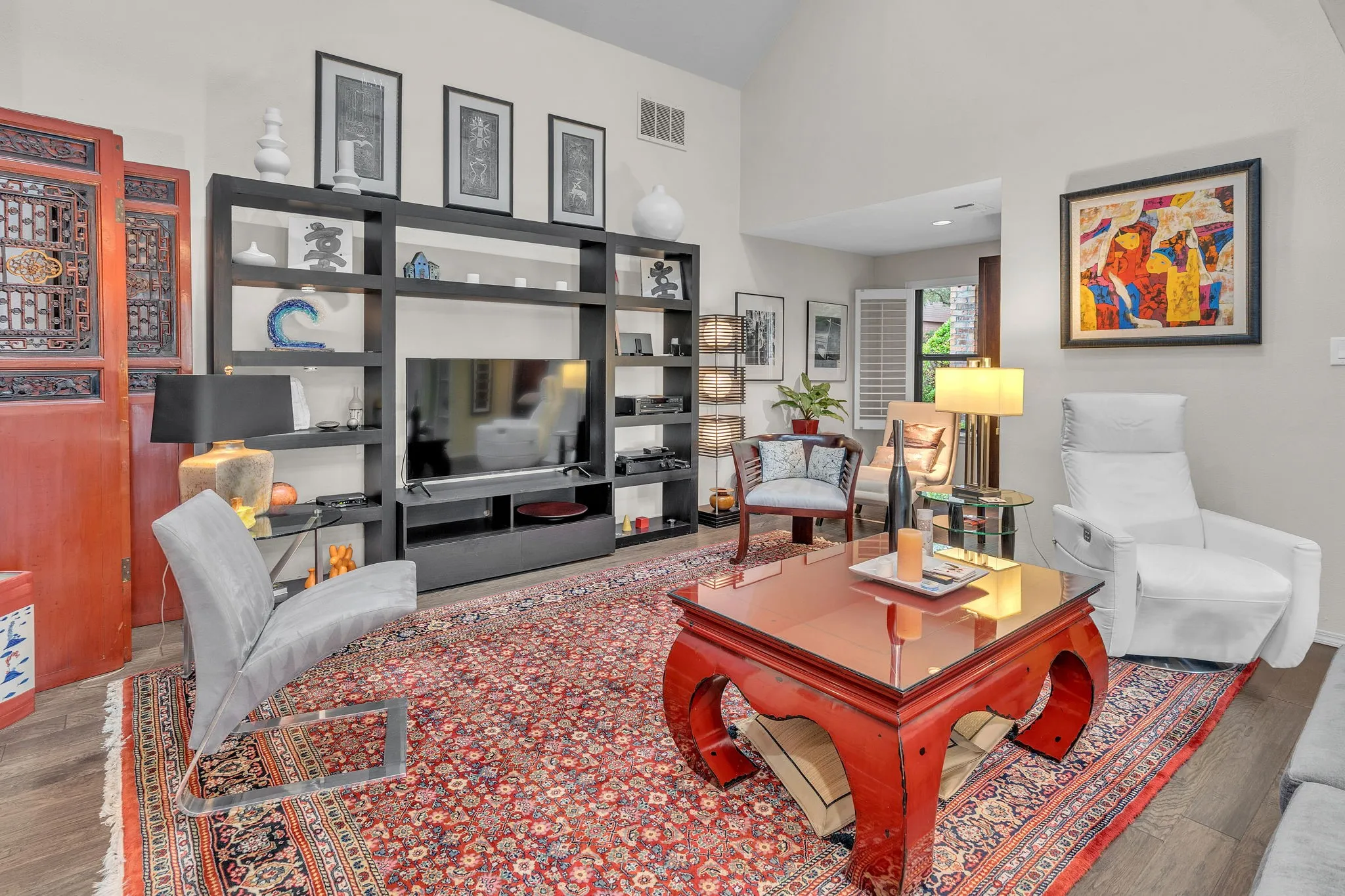 Living area with wood flooring and separate reading area