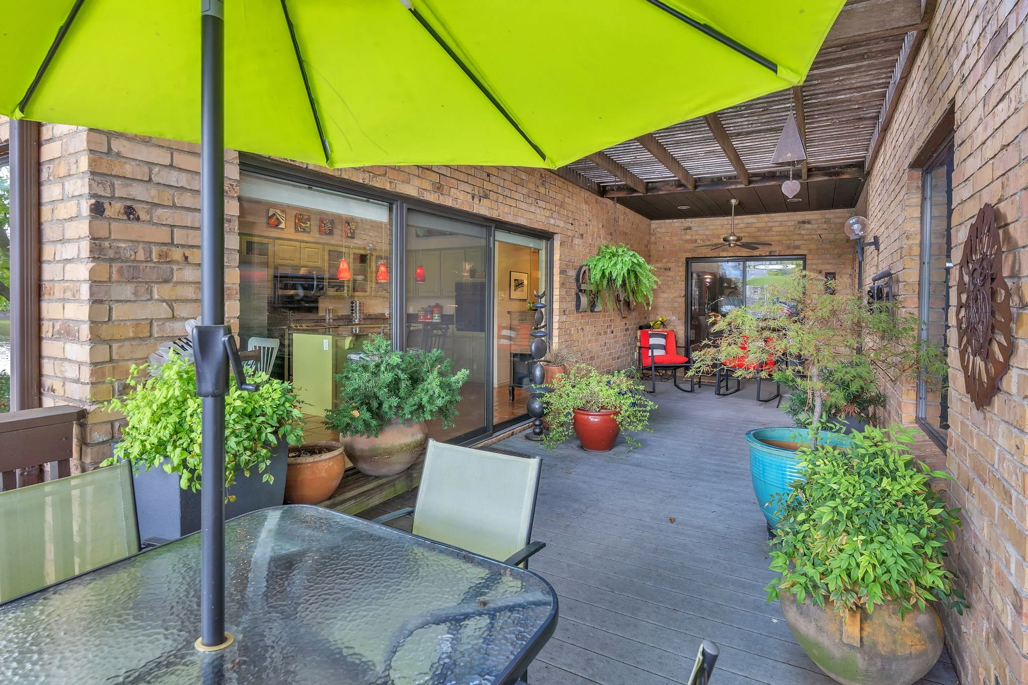 Patio with many doorways and windows to view this serene area with nature