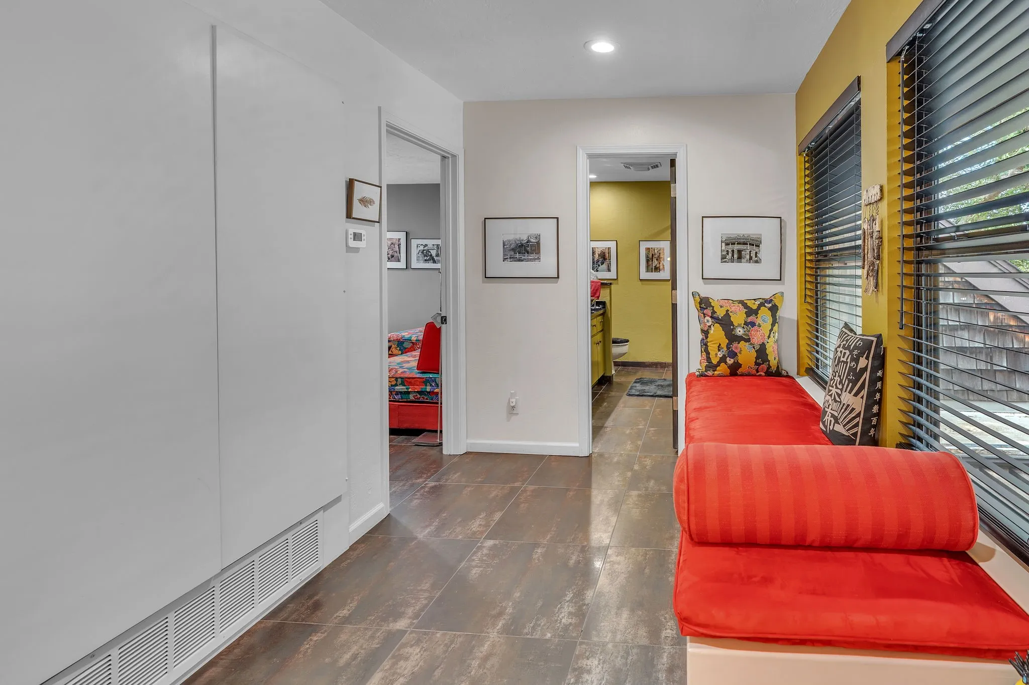 Upstairs cushioned window seat with storage and a view of the lake