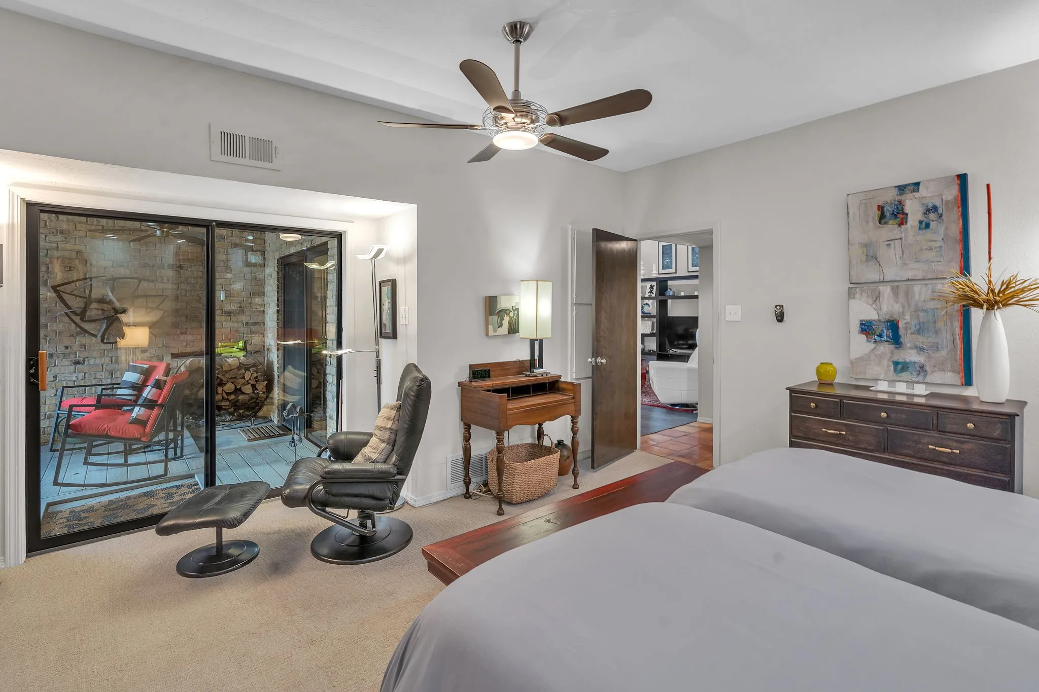 Primary bedroom with view of inviting patio