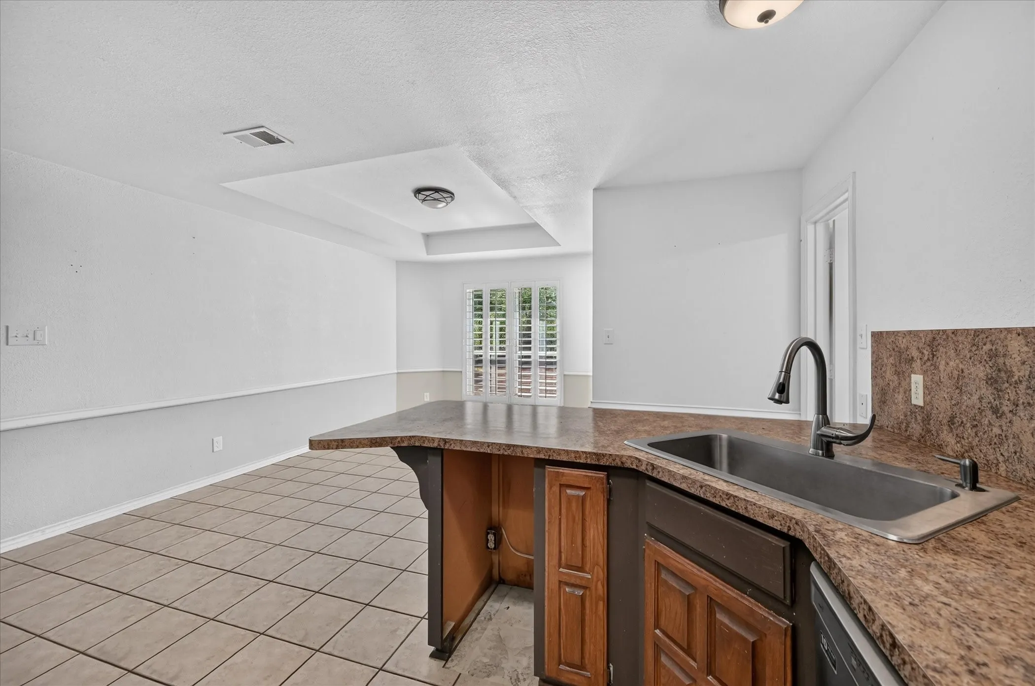 Kitchen island with an undermount sink and gooseneck faucet