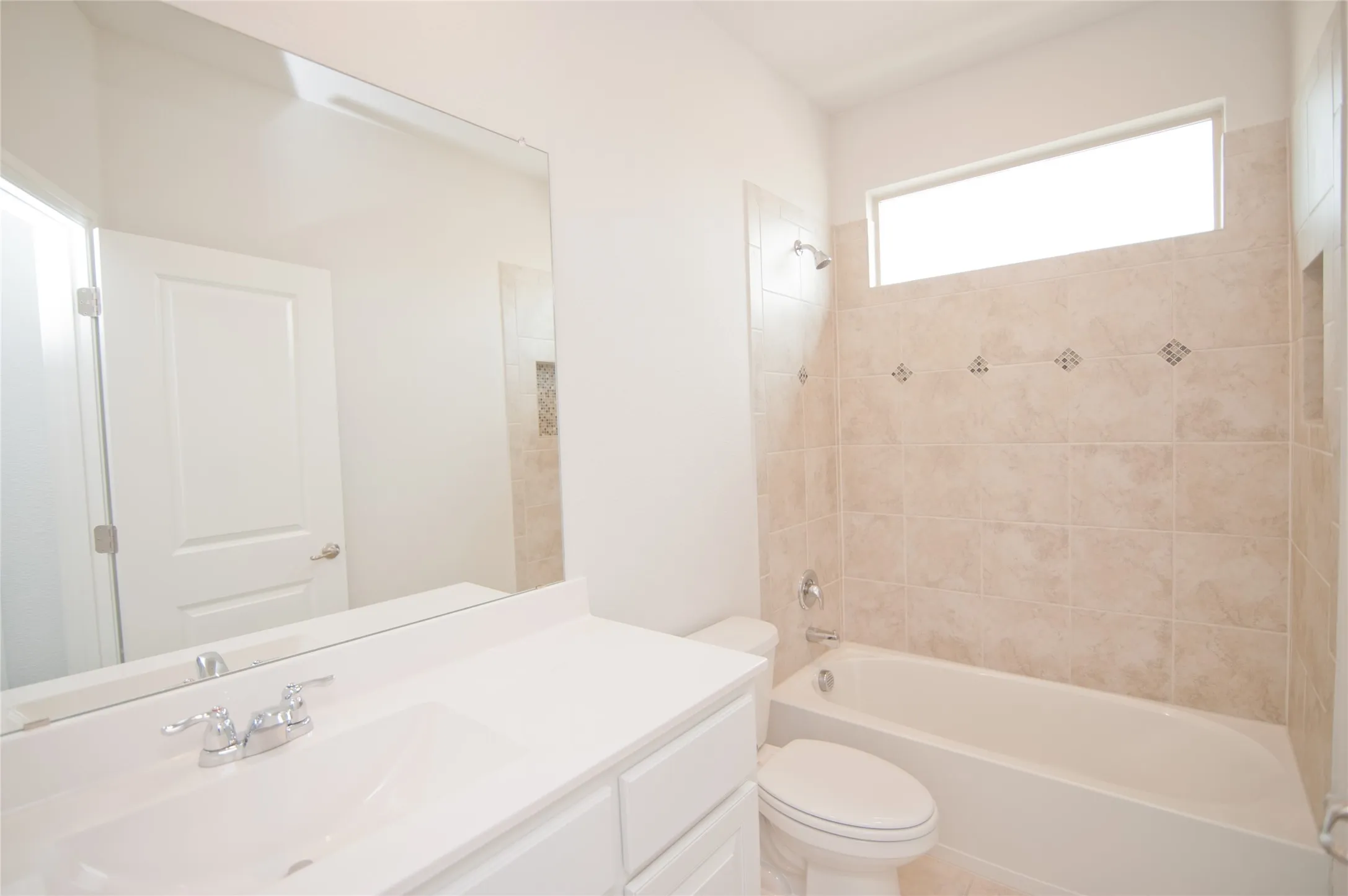 White vanity with an integrated sink and chrome faucet