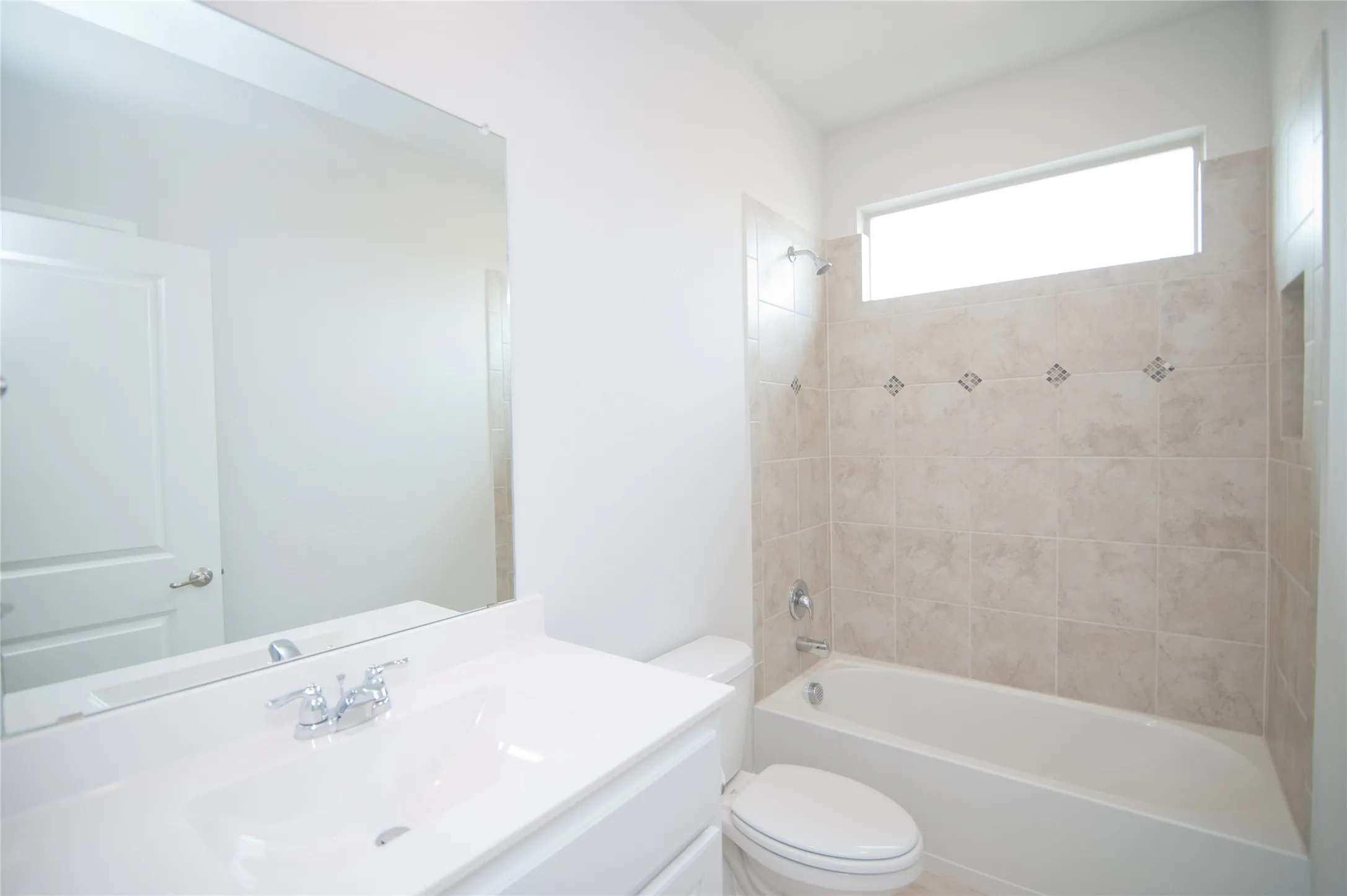 White vanity with an integrated sink and chrome faucet