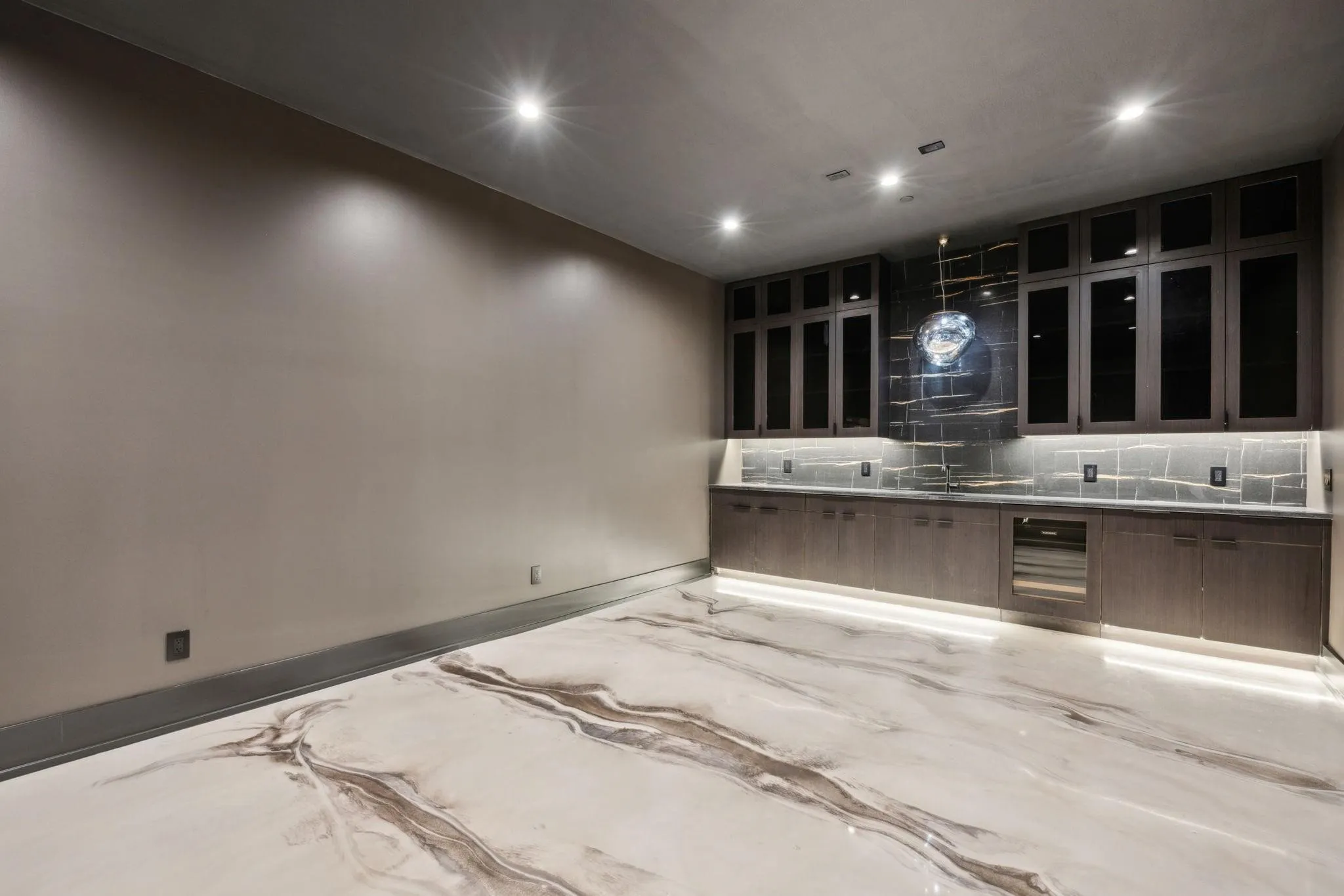 Basement Media room with ice machine, beverage refridgerator, built in shelving and cabinetry
