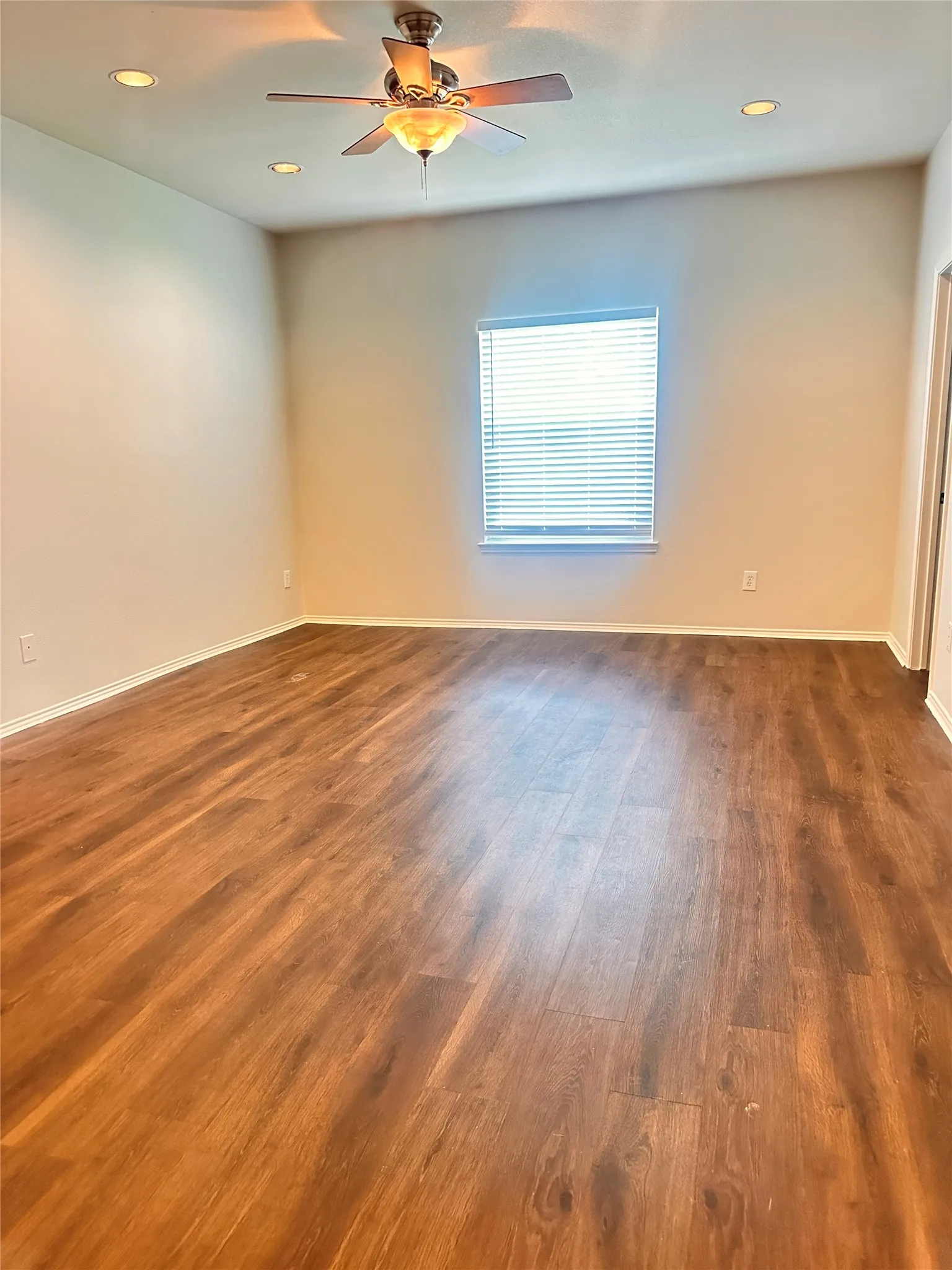 Empty room featuring recessed lighting, dark wood finished floors, and ceiling fan