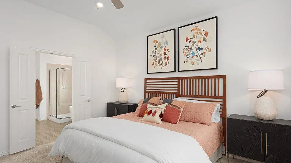 Vaulted ceiling, ceiling fan, carpet flooring, double doors, and wood-finish flooring
