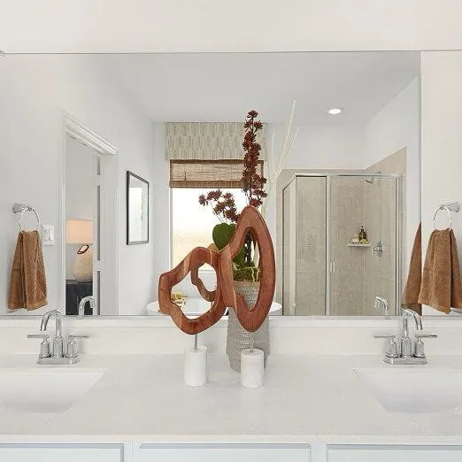 Dual vanity with undermount sinks, chrome fixtures, and a spacious countertop