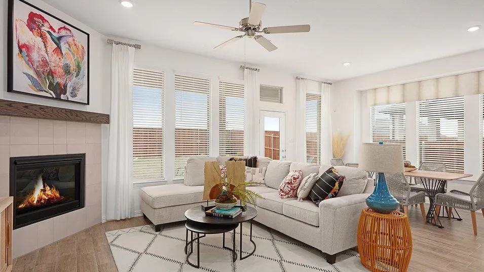 Recessed lighting, wood-finish flooring, a ceiling fan, and multiple windows with blinds