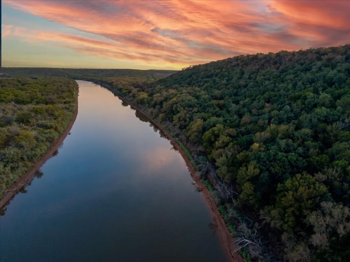 River meandering through wooded landscape