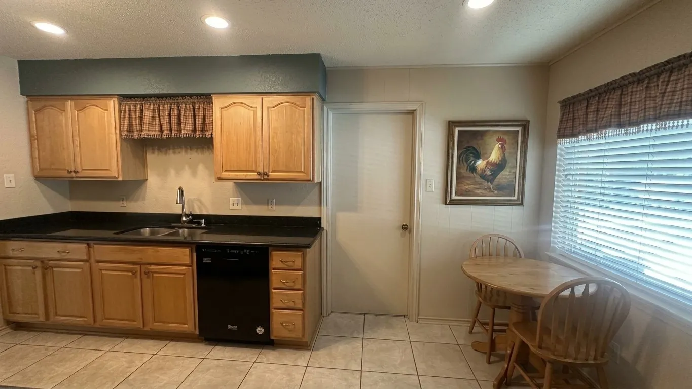 Staged AI furniture; Breakfast area off kitchen - nice window view of yard, pool.