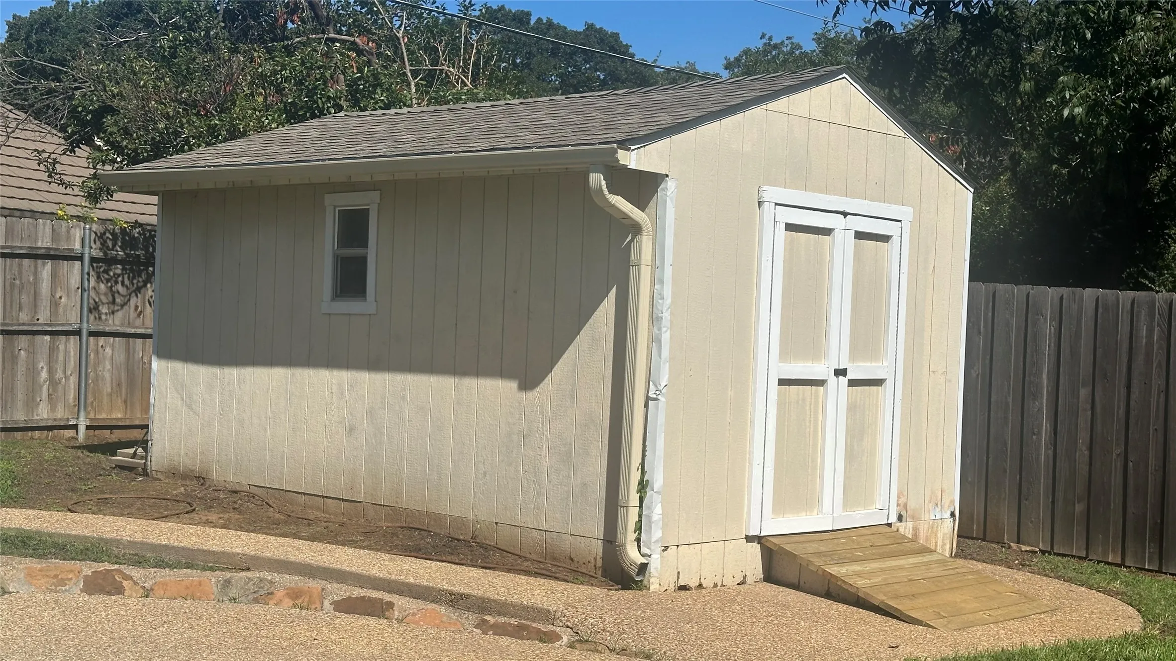 Built-in shelving, ramp into doorway-shed, great storage and-or work space.