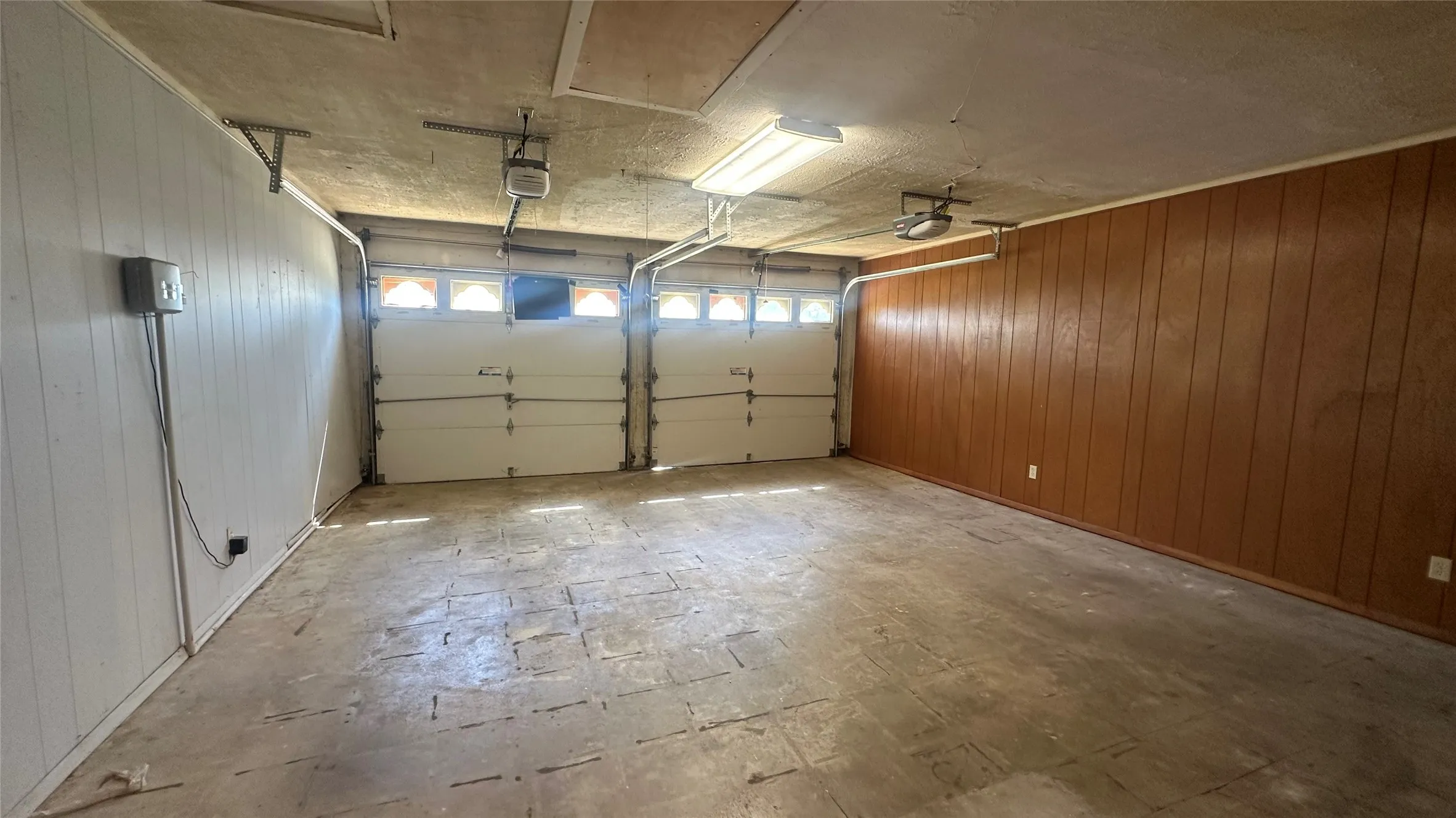 Garage, 2 single doors.  Had been air conditioned but vent tubes closed off.