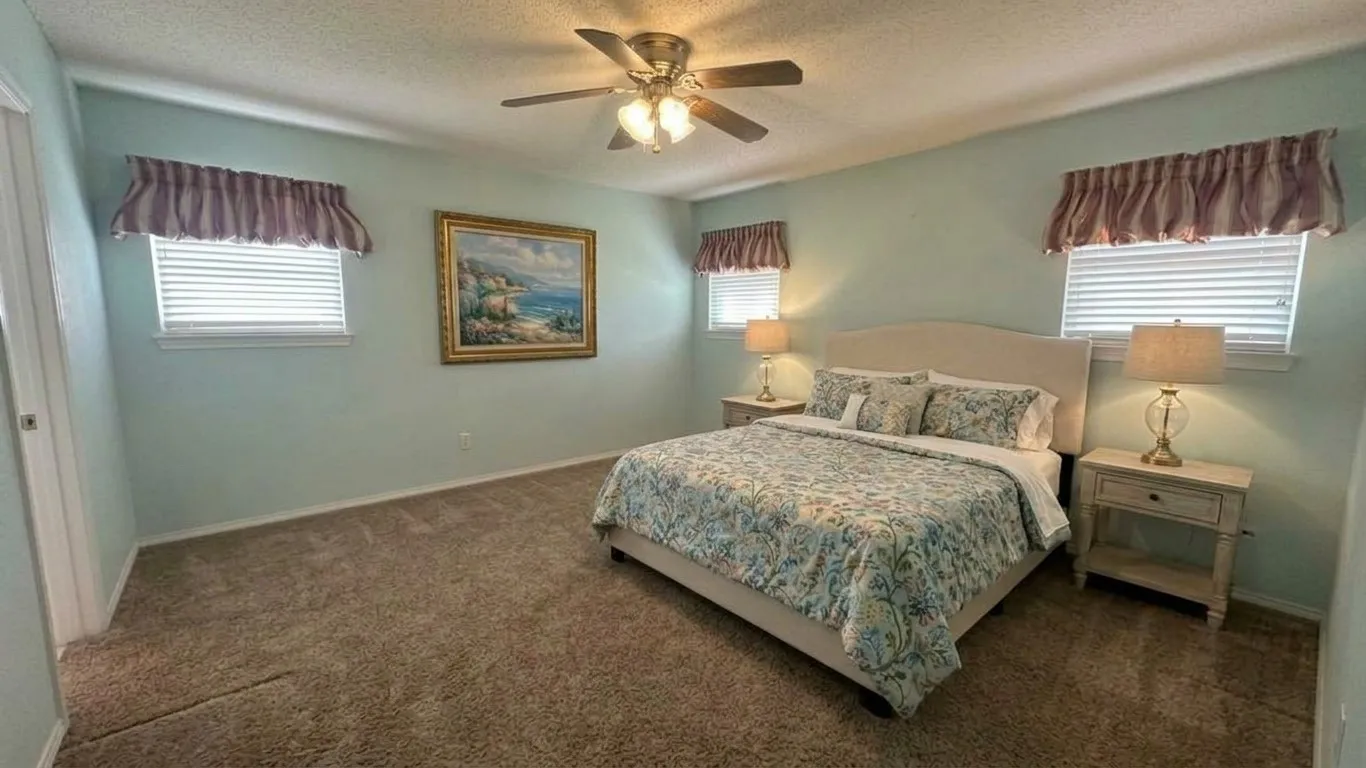 Staged AI furniture; -nice size suite with 3 windows & blinds.