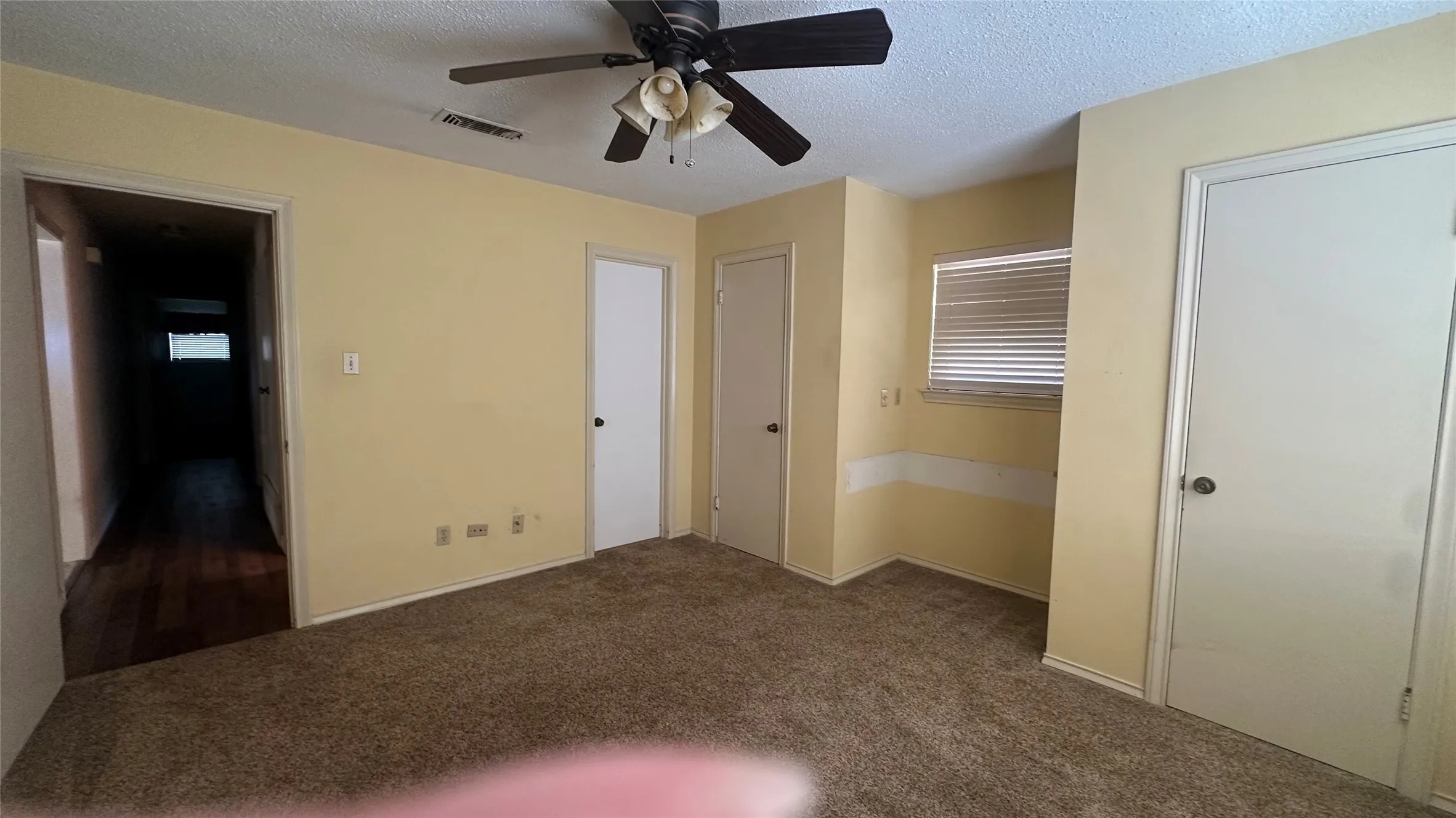 View 2 unfurnished of front BR.  Corner door is direct access to Hall bathroom.