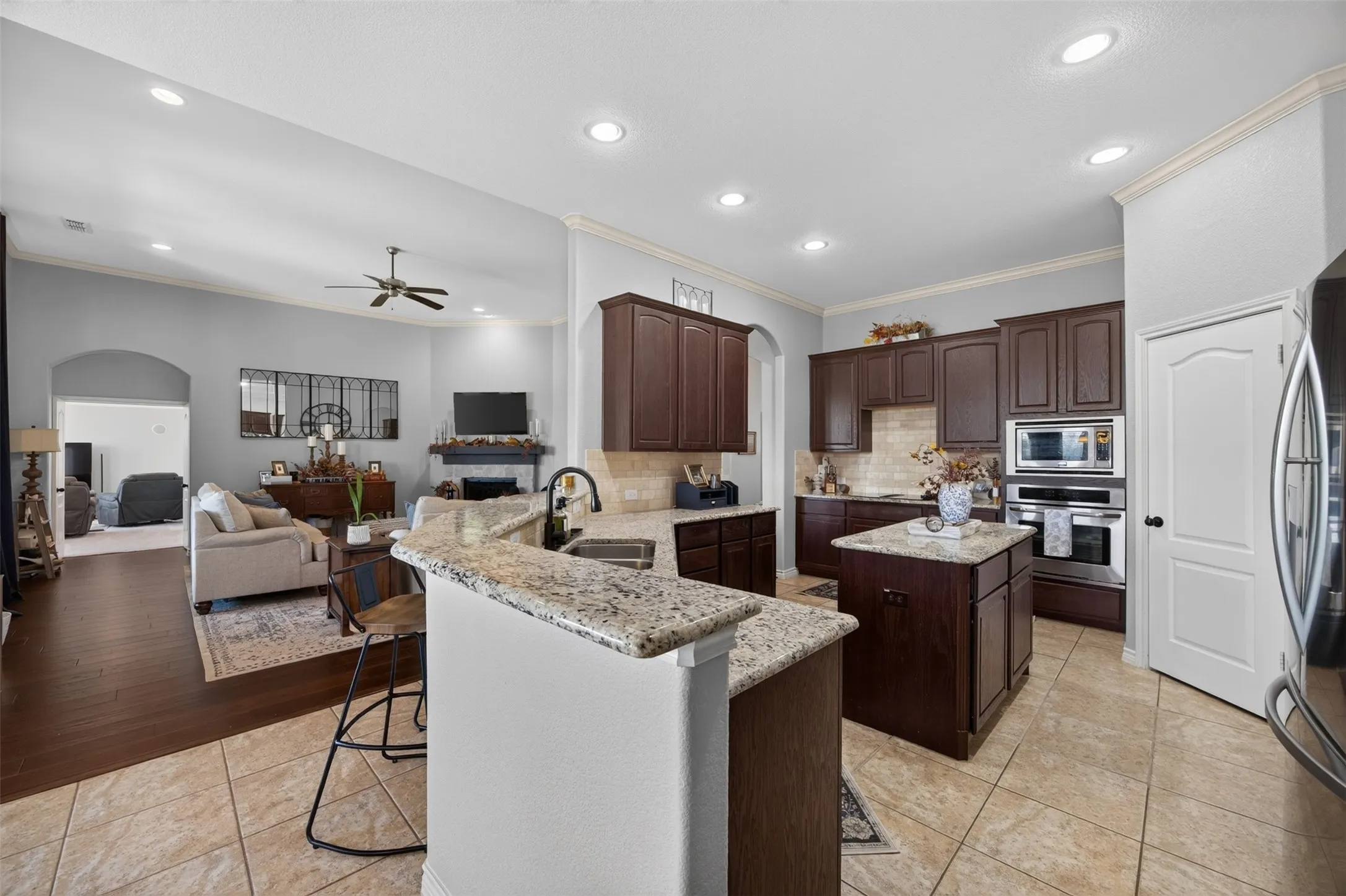 Granite kitchen with island and walk-in pantry