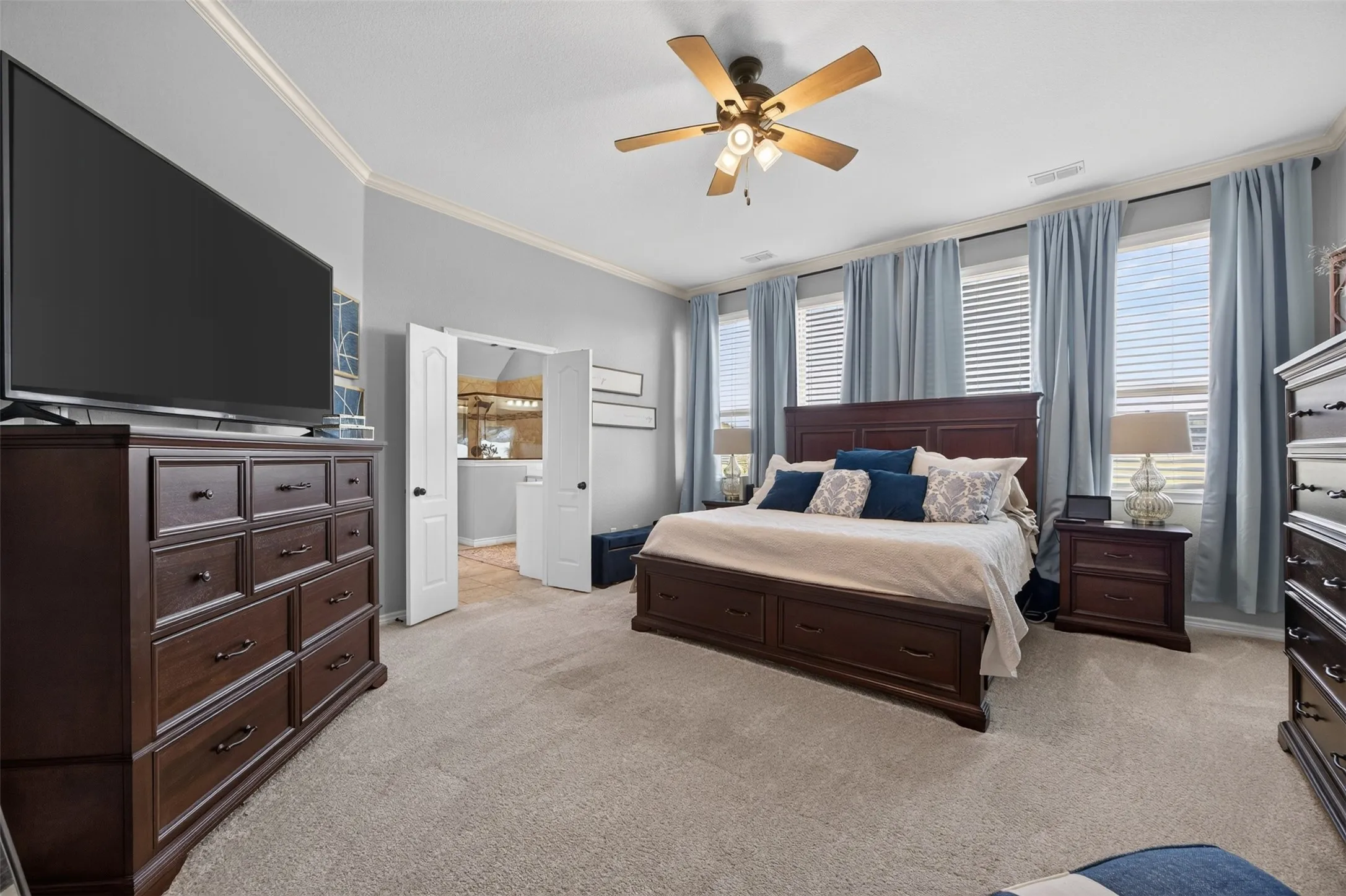 Main primary suite at the back of the home with sitting area
