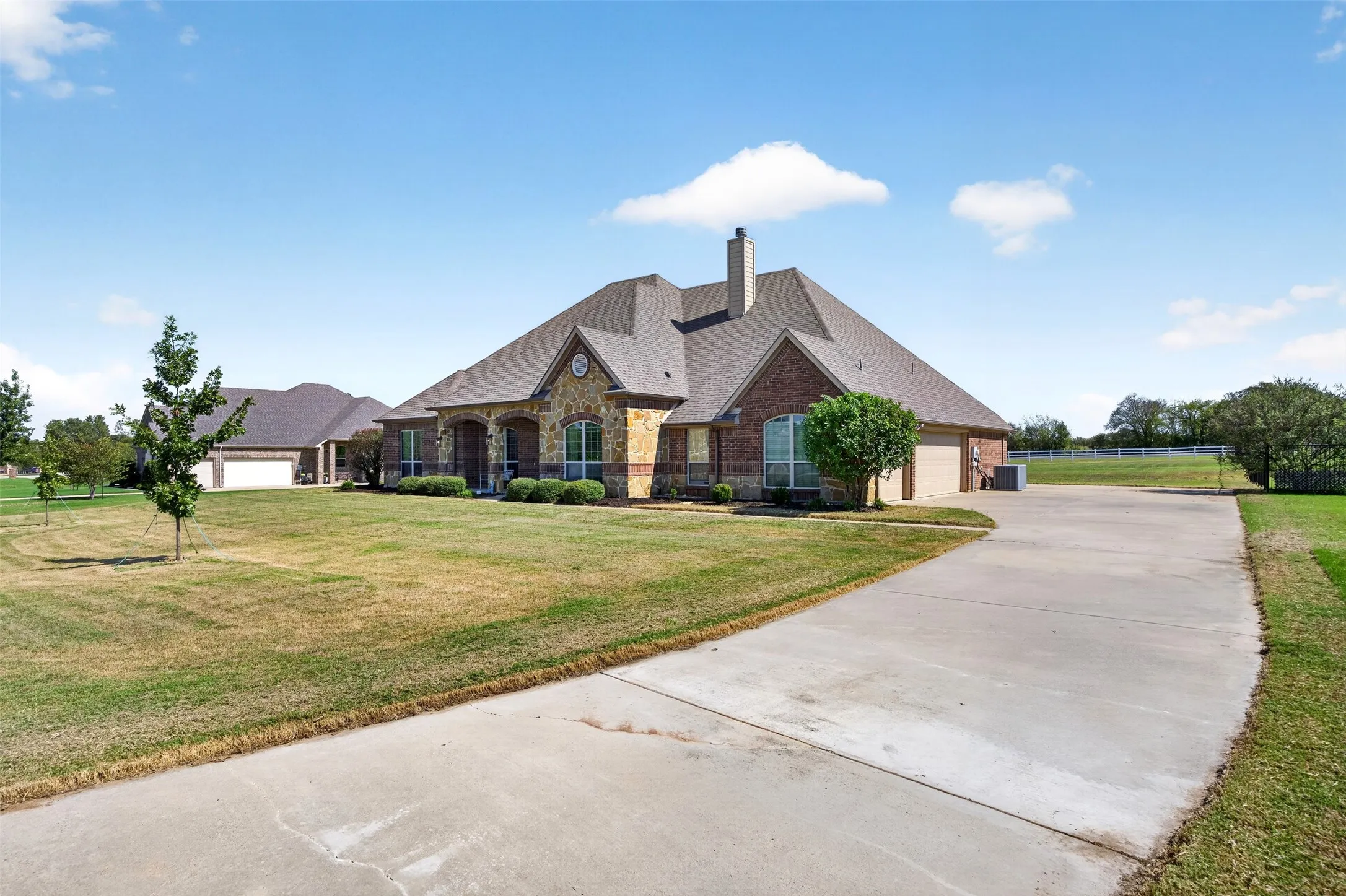 2015 single-story brick and stone home on 1.01 acres