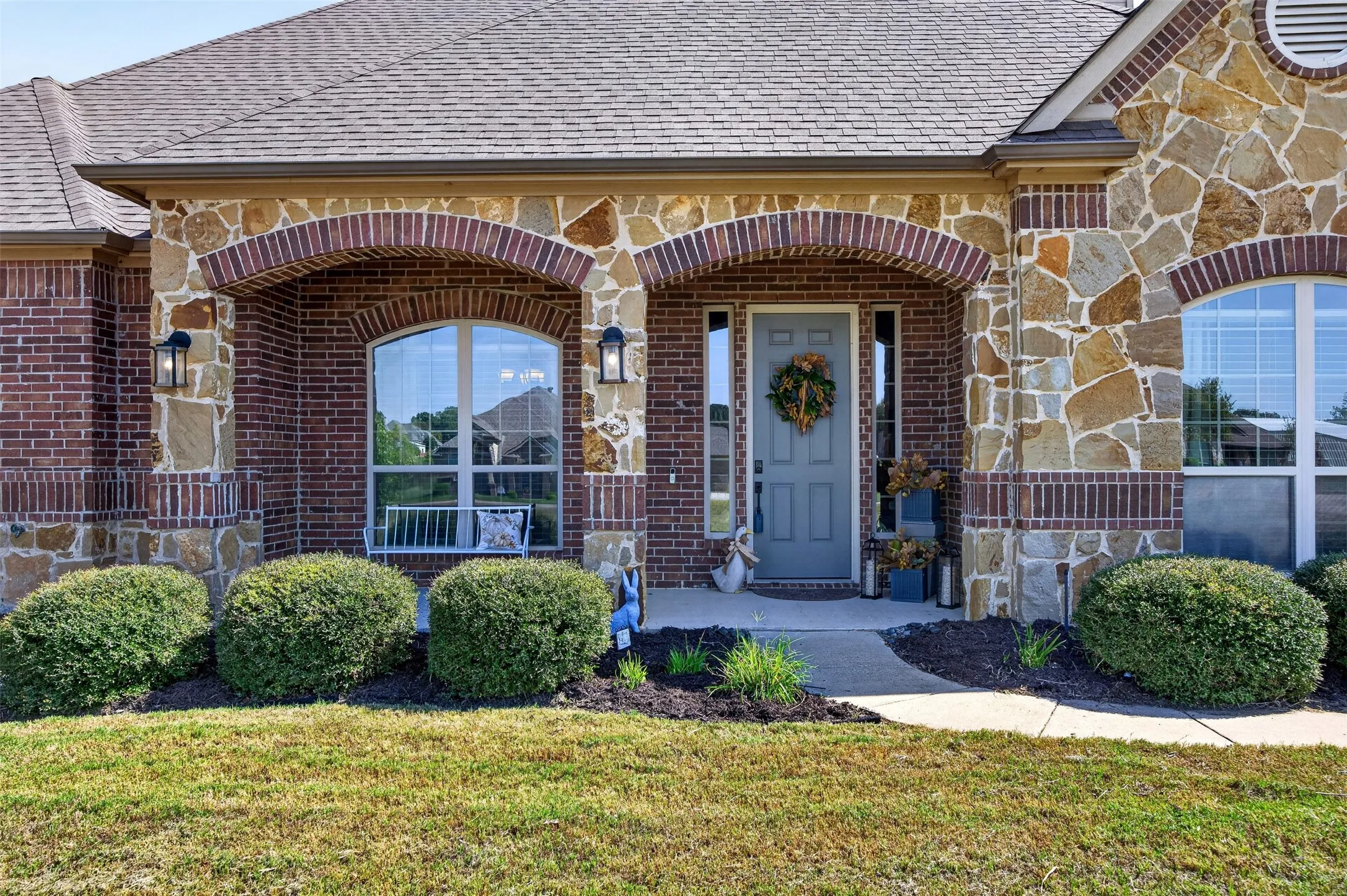 Brick and stone exterior with arched accents